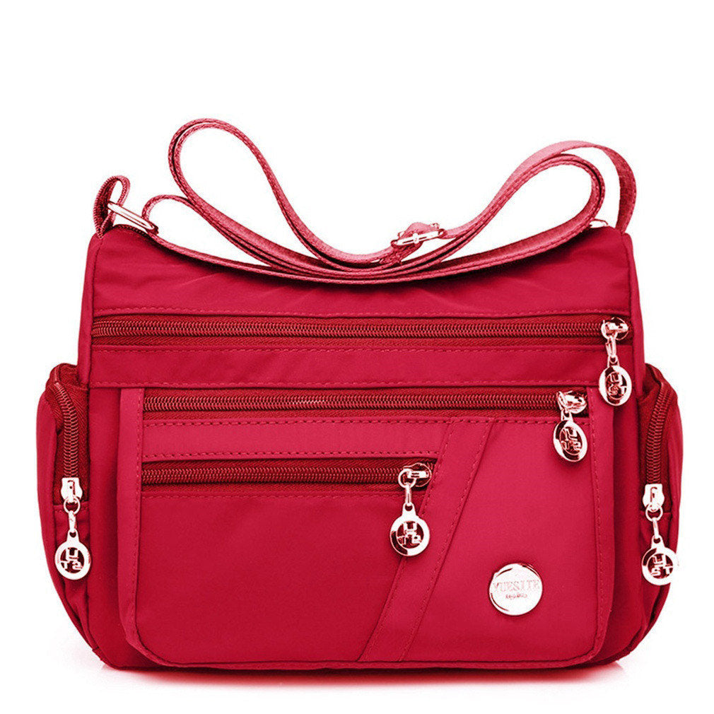 Multi-Compartment Casual One-Shoulder Messenger Bag in Oxford fabric with zipper opening and telescopic handle.