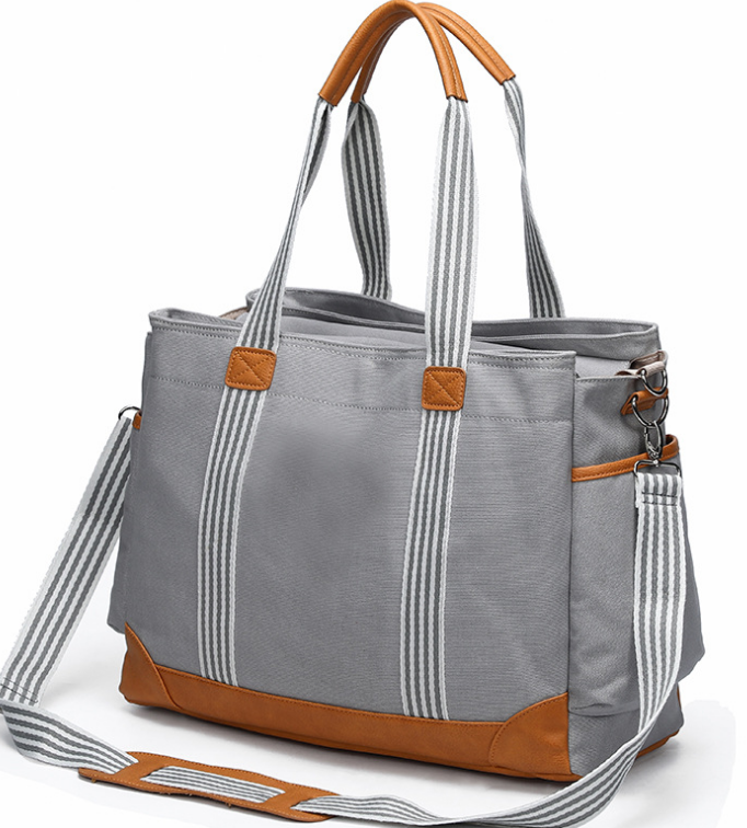 Multifunctional Large-capacity Canvas Portable Mummy Bag in stylish design, showcasing its spacious interior and durable polyester material.