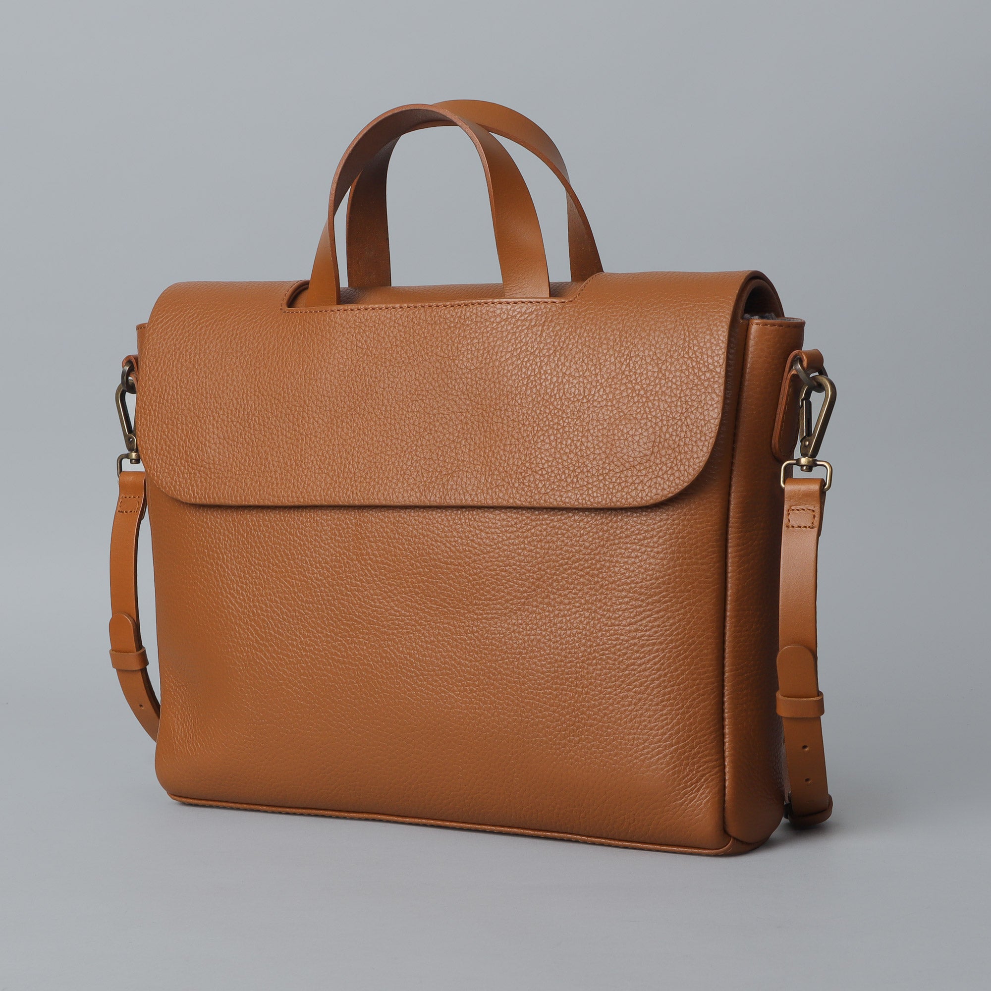 Muse Leather Briefcase showcasing premium full grain leather, spacious compartments, and elegant design.