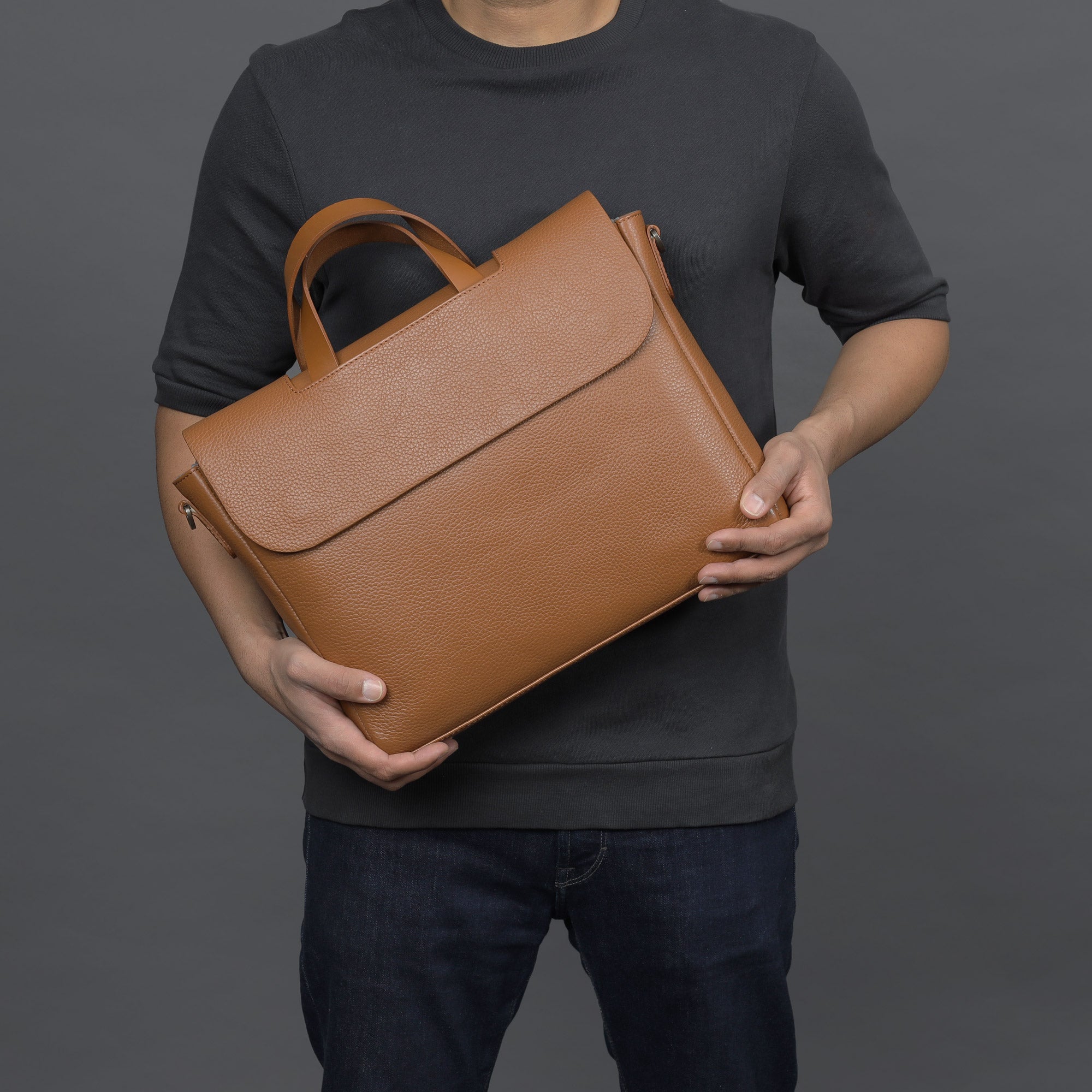 Muse Leather Briefcase showcasing premium full grain leather, spacious compartments, and elegant design.