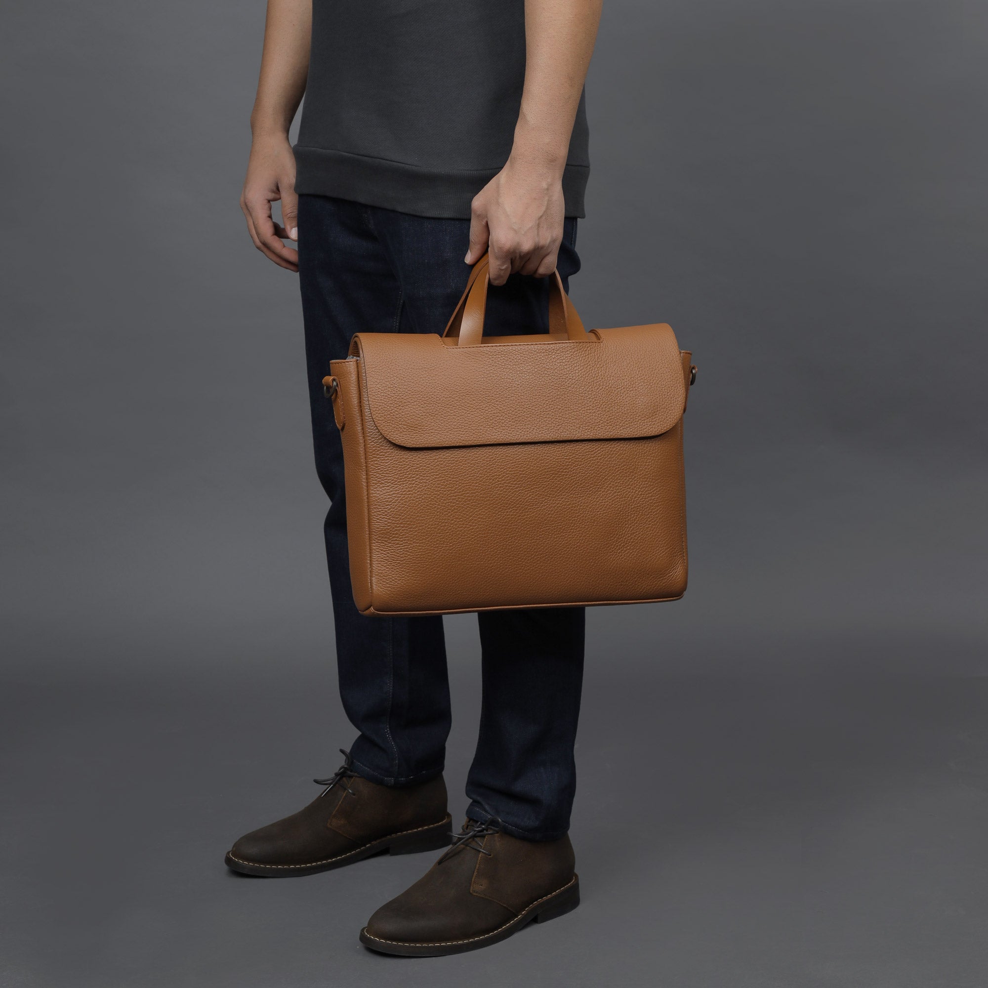 Muse Leather Briefcase showcasing premium full grain leather, spacious compartments, and elegant design.