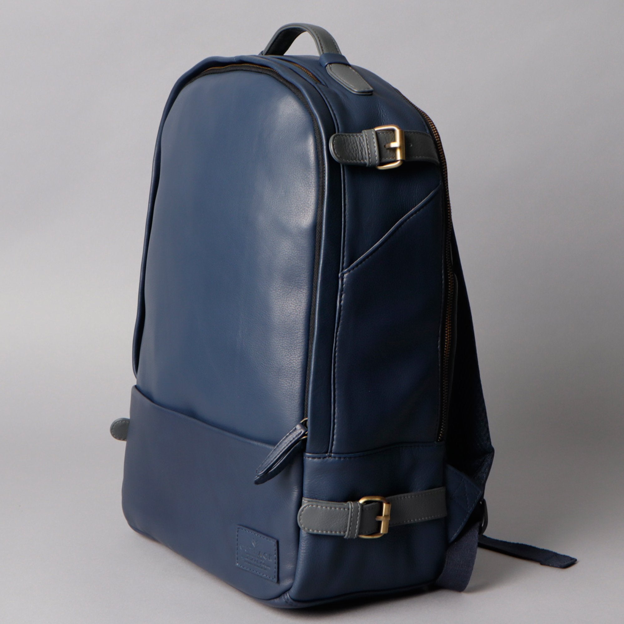 Mustang Leather Backpack showcasing premium full grain leather, multiple pockets, and adjustable straps.