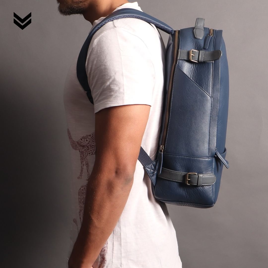 Mustang Leather Backpack showcasing premium full grain leather, multiple pockets, and adjustable straps.