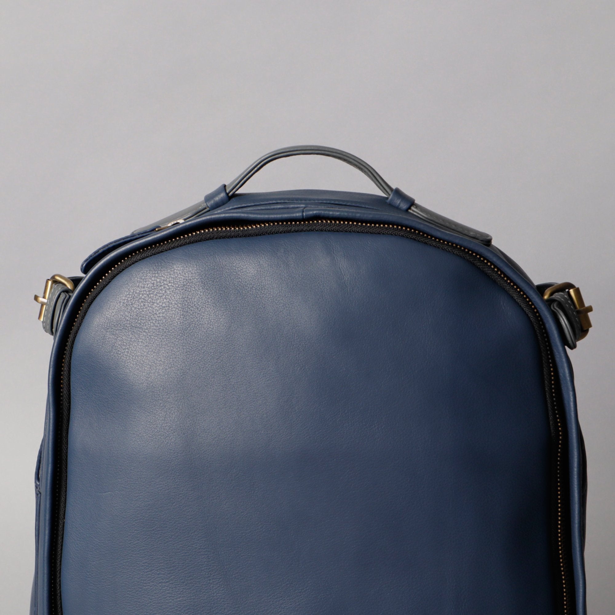 Mustang Leather Backpack showcasing premium full grain leather, multiple pockets, and adjustable straps.