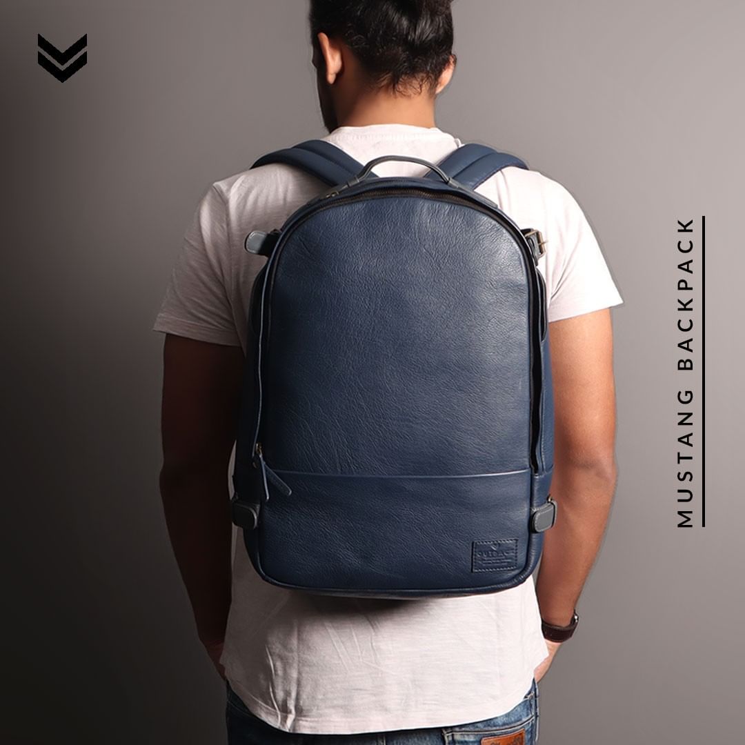 Mustang Leather Backpack showcasing premium full grain leather, multiple pockets, and adjustable straps.