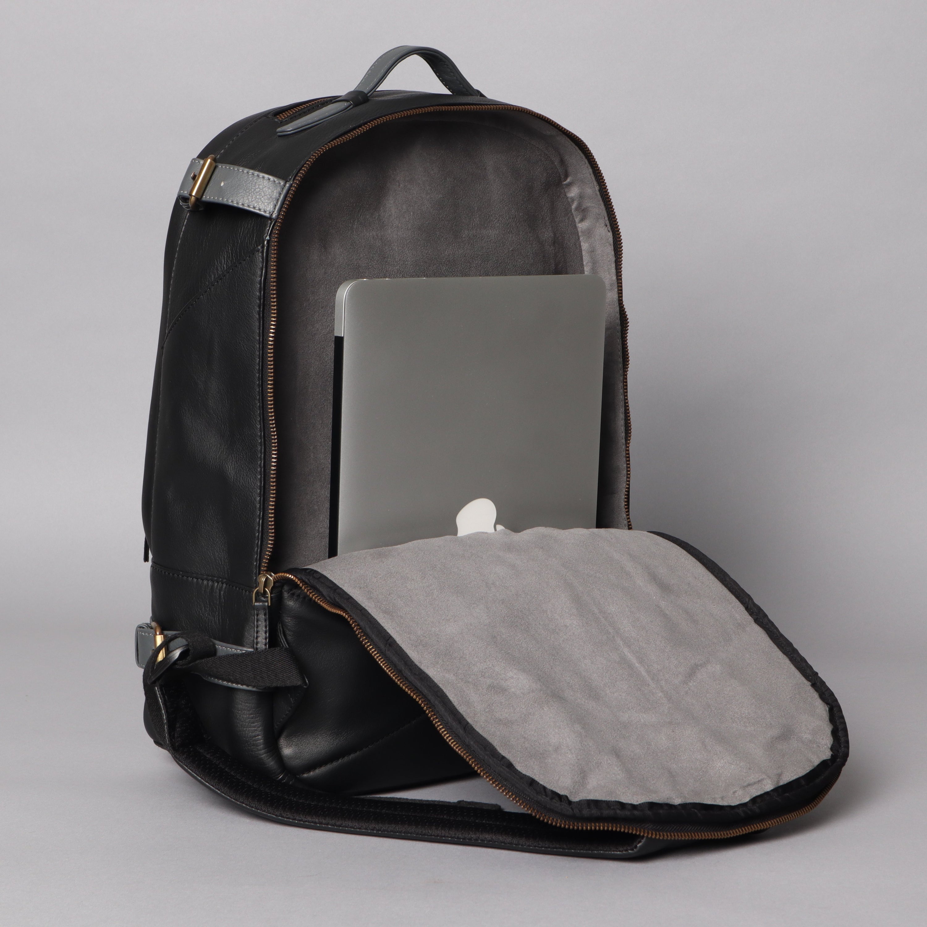 Mustang Leather Backpack made from premium full grain leather, featuring multiple pockets and adjustable straps, perfect for carrying laptops and essentials.