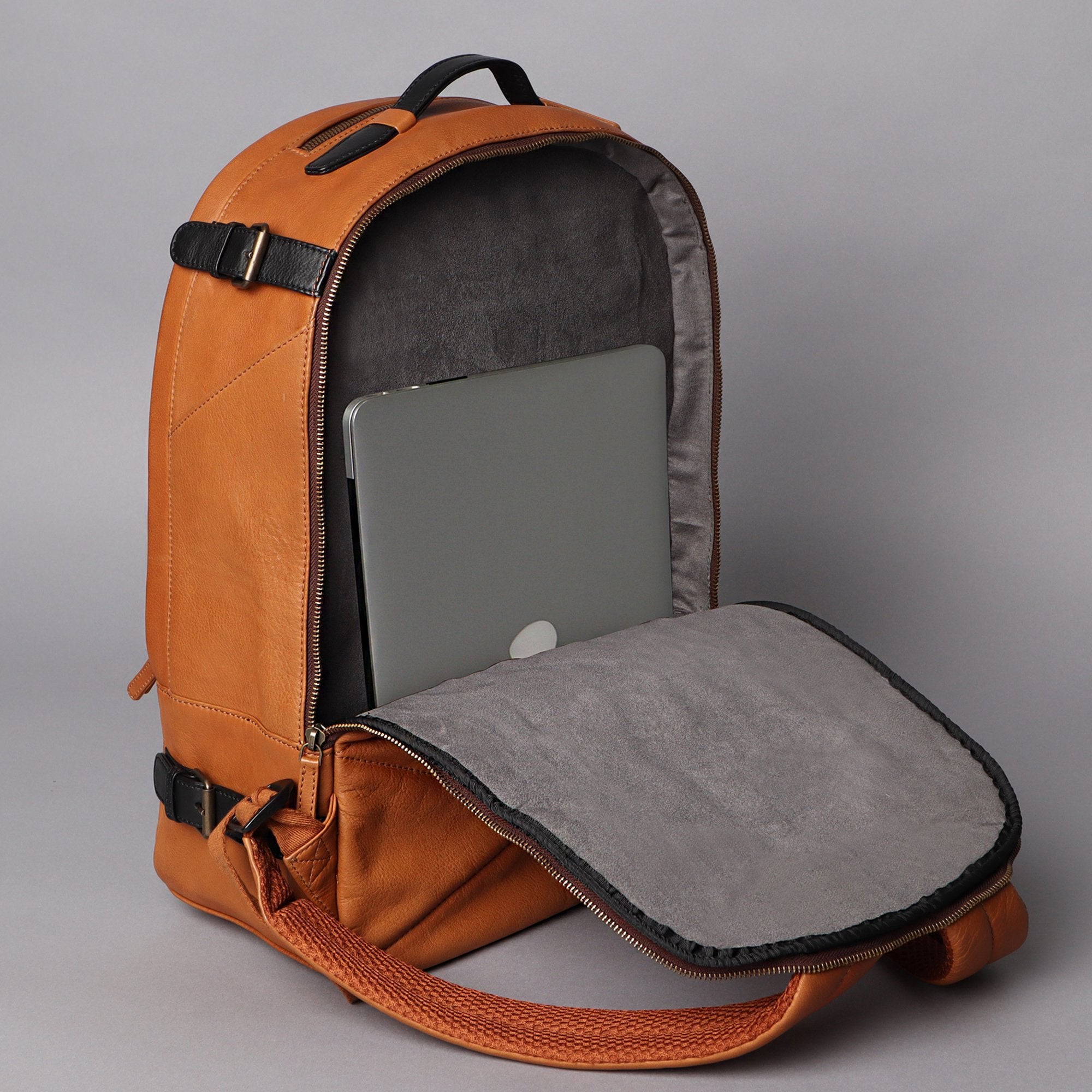 Mustang Leather Backpack showcasing premium full-grain leather, multiple pockets, and adjustable straps.