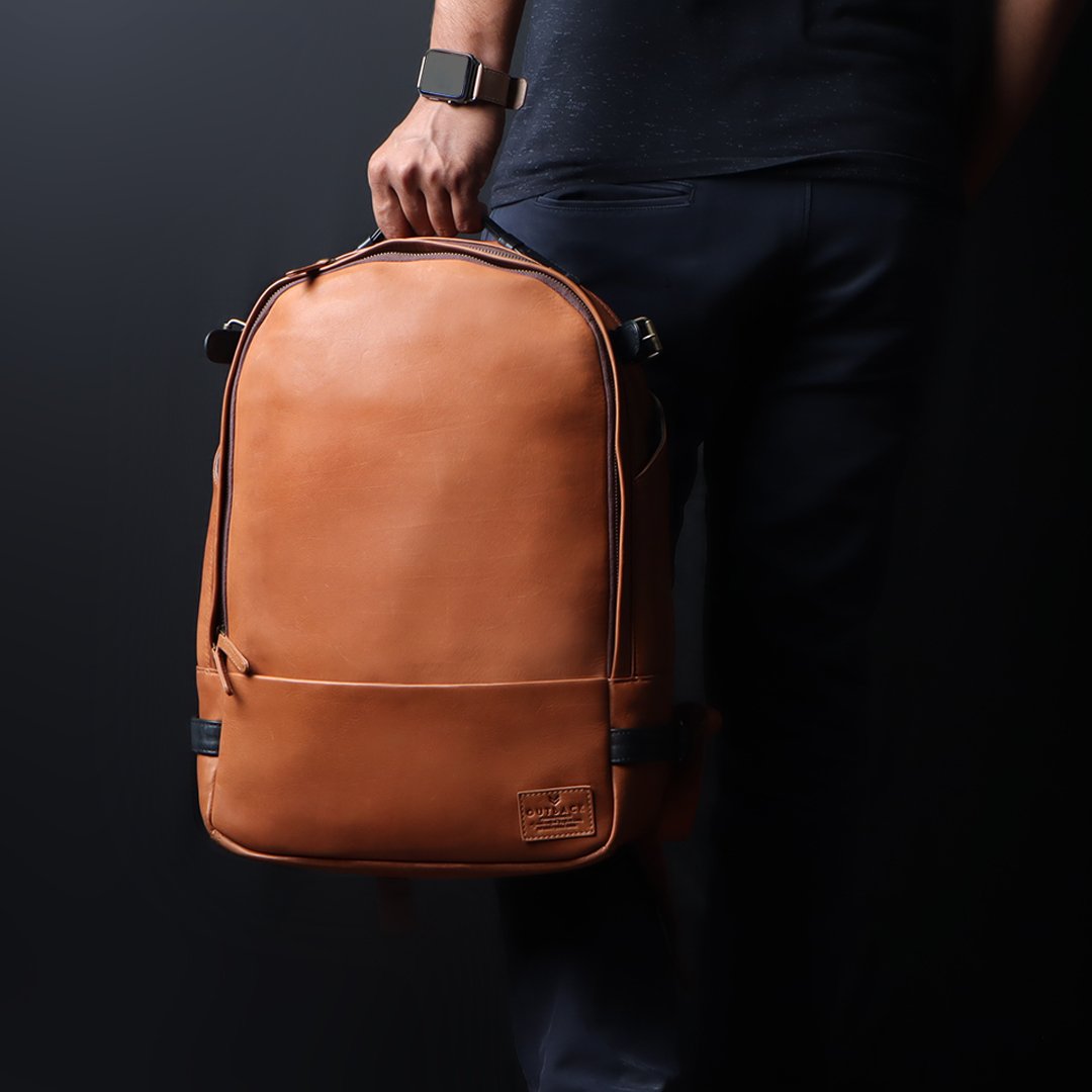 Mustang Leather Backpack showcasing premium full-grain leather, multiple pockets, and adjustable straps.