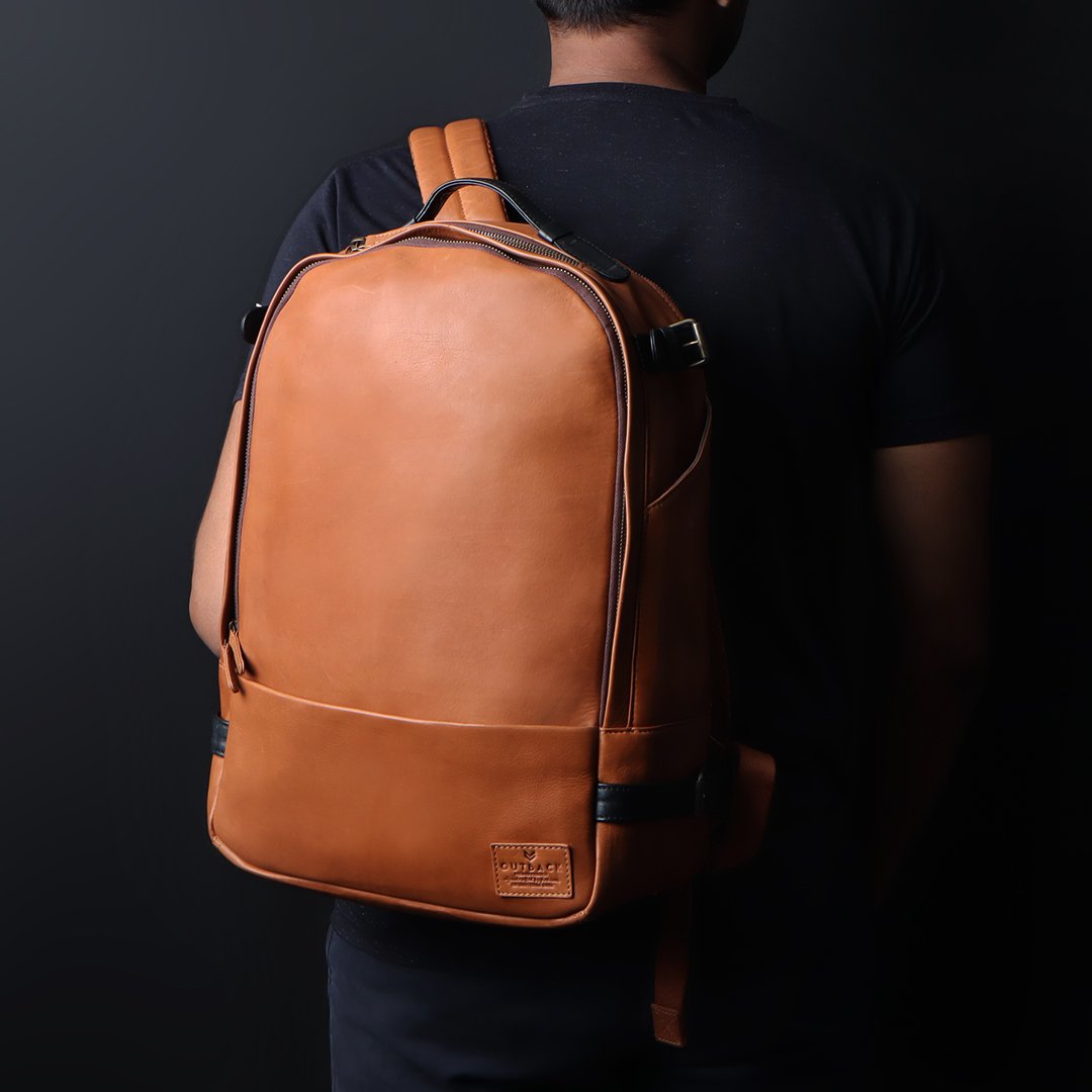 Mustang Leather Backpack showcasing premium full-grain leather, multiple pockets, and adjustable straps.