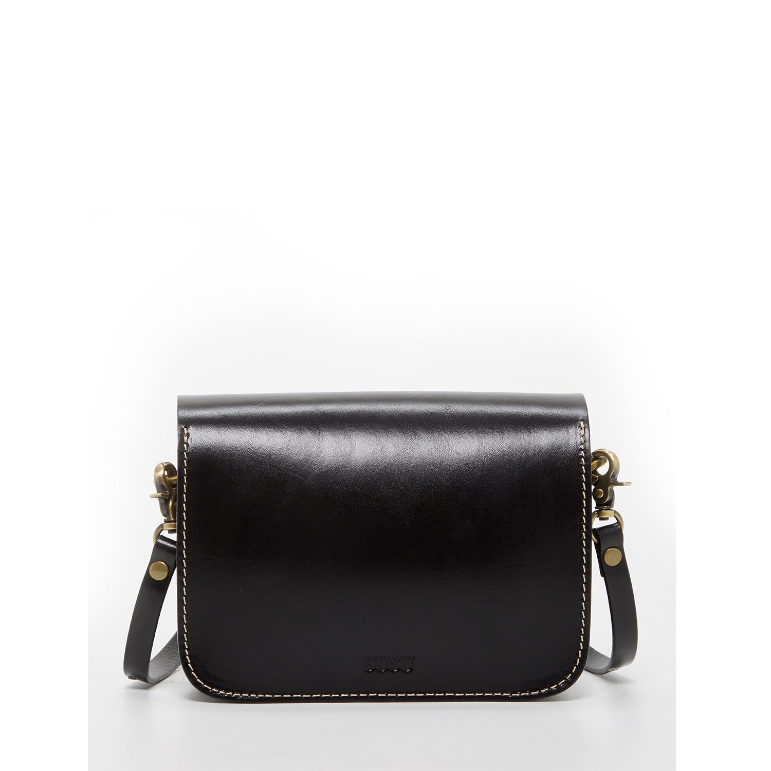 Nanah Black Leather Crossbody Bag featuring a boxy shape, bronze hardware, and adjustable strap, perfect for hands-free travel.