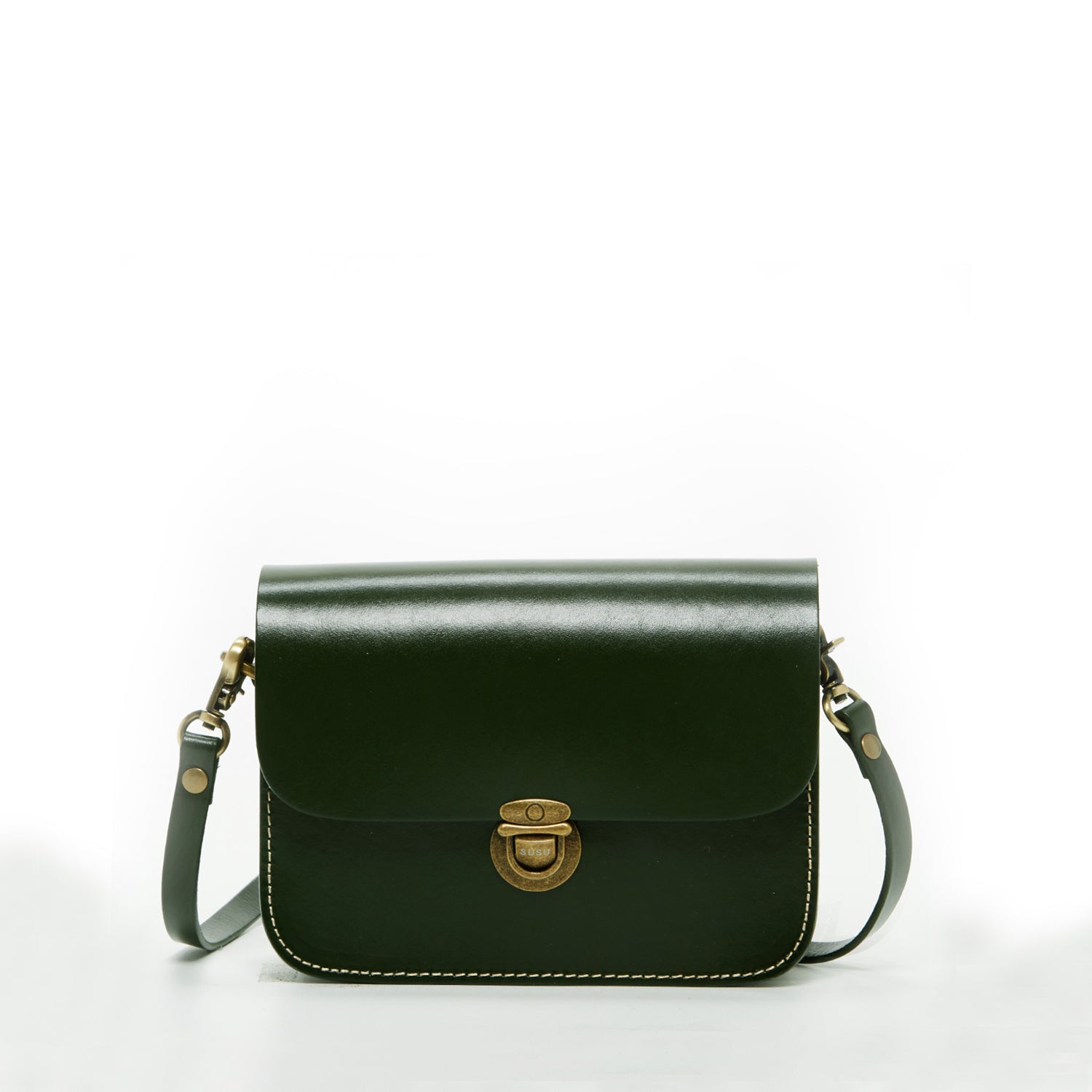 Nanah Dark Green Leather Crossbody Bag with bronze hardware and adjustable strap, showcasing a vintage camera bag design.