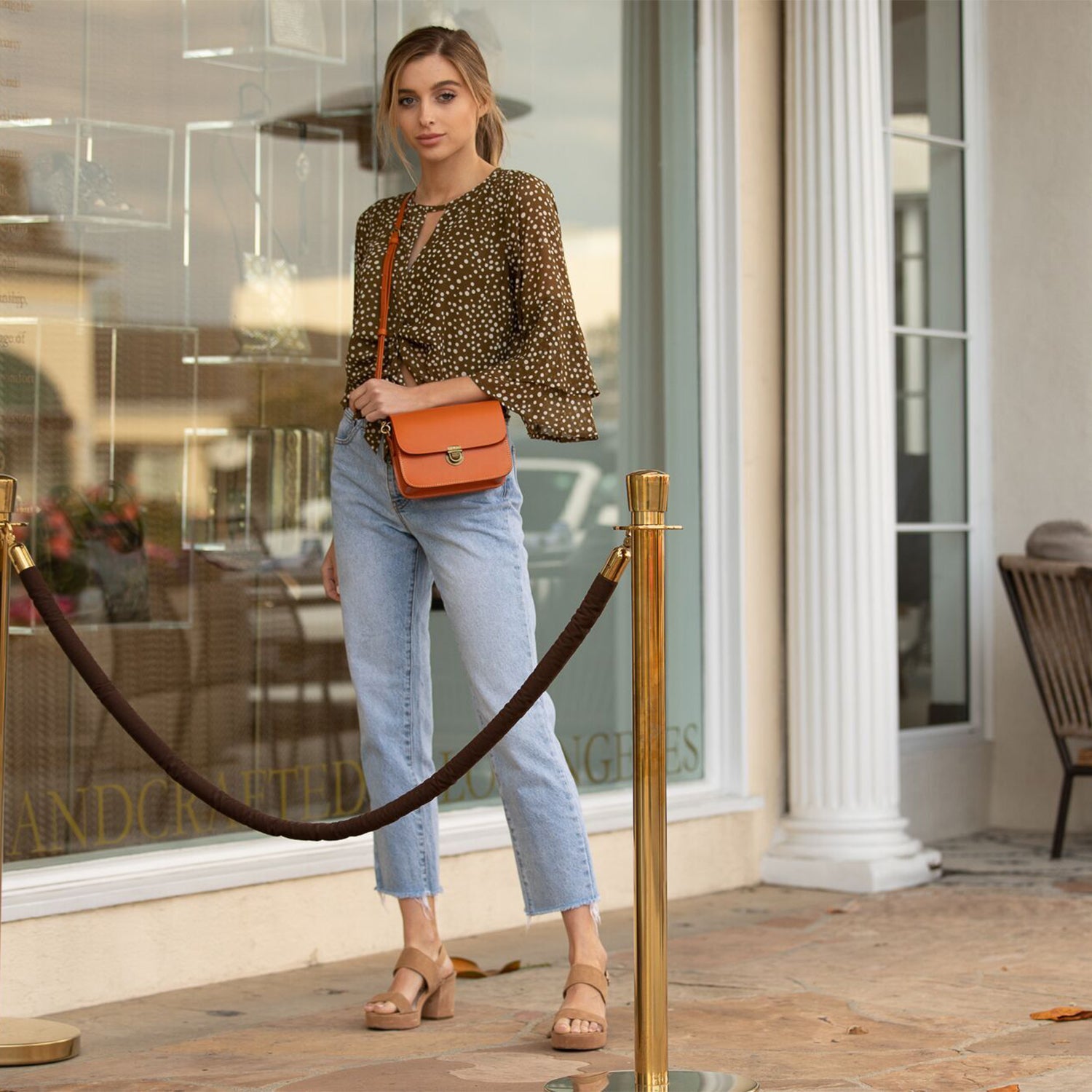 Nanah Light Brown Leather Crossbody Bag with adjustable strap and bronze hardware, showcasing its vintage-inspired design.