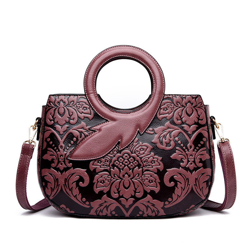 National Style One Shoulder Soft Leather Bag in oval shape, showcasing its stylish design and large capacity.