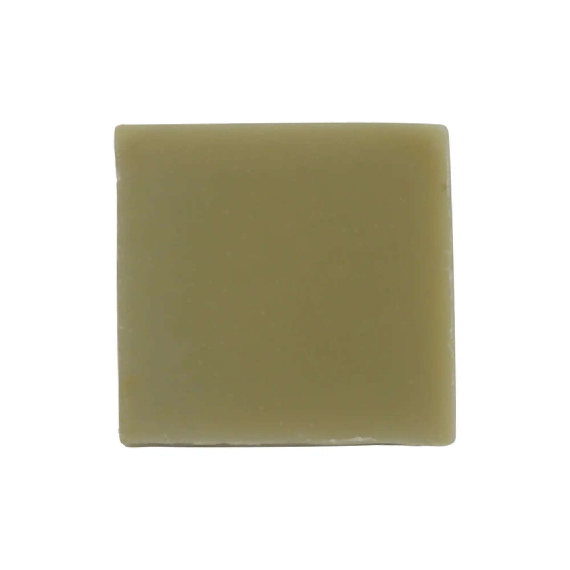 Natural Green Tea Lemongrass Calming Soap bar with green tea leaves and lemongrass, showcasing its natural ingredients and soothing properties.