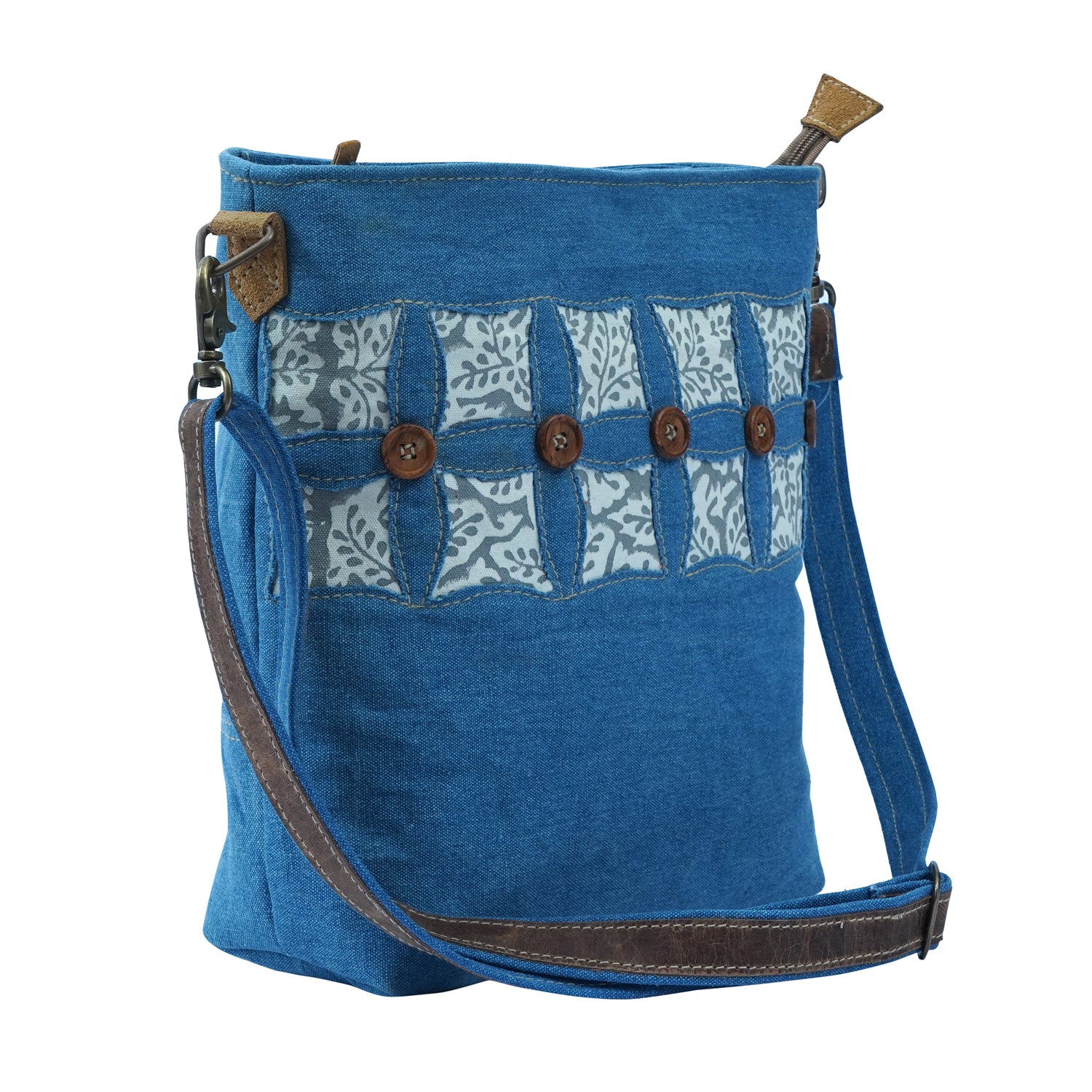 Niro Shoulder Bag made of denim and canvas, featuring an adjustable strap and spacious interior, perfect for various occasions.