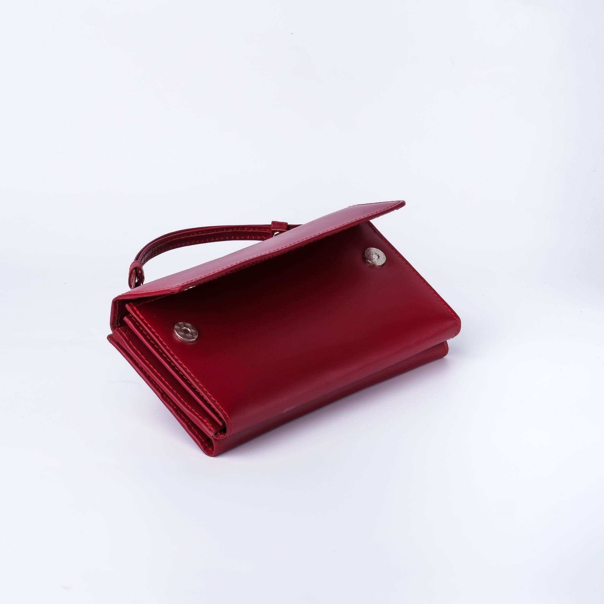 Nova-Womens Handle Leather Clutch Wallet in Red, featuring adjustable handle strap and secure magnetic and zipper closures.