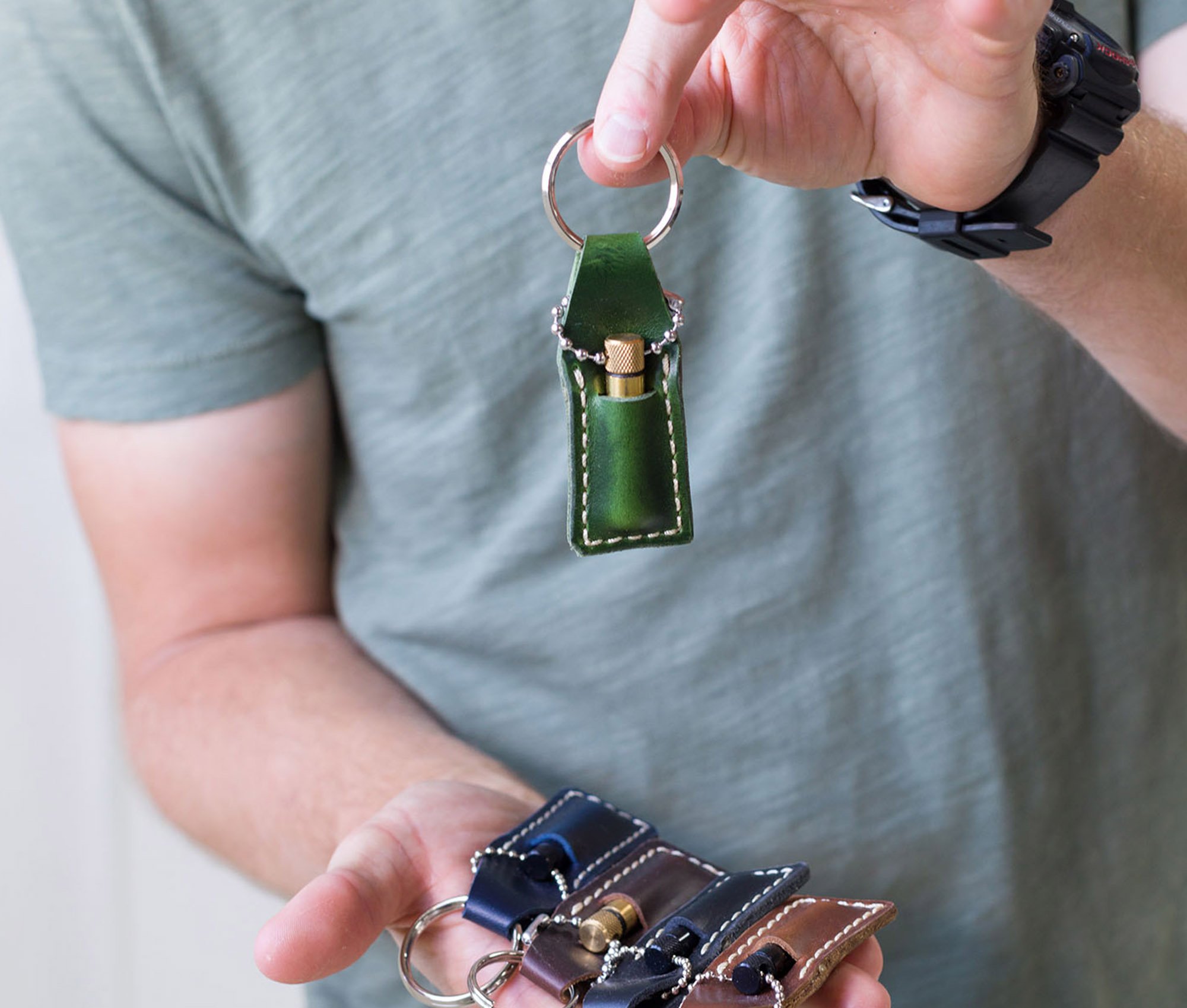 Handcrafted Oil Vial made of genuine leather, featuring a brass cap and silver chain, ideal for storing oils and perfumes.