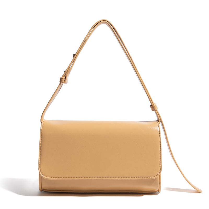 One-shoulder women's fashion simple underarm bag made of PU leather, featuring a magnetic buckle closure and a sleek horizontal square shape.