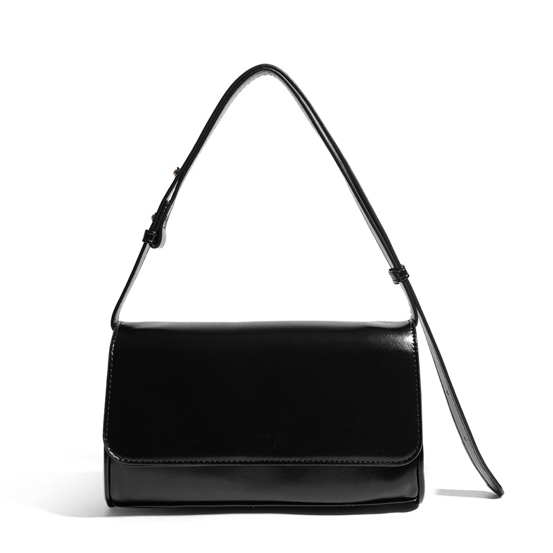 One-shoulder women's fashion simple underarm bag made of PU leather, featuring a magnetic buckle closure and a sleek horizontal square shape.