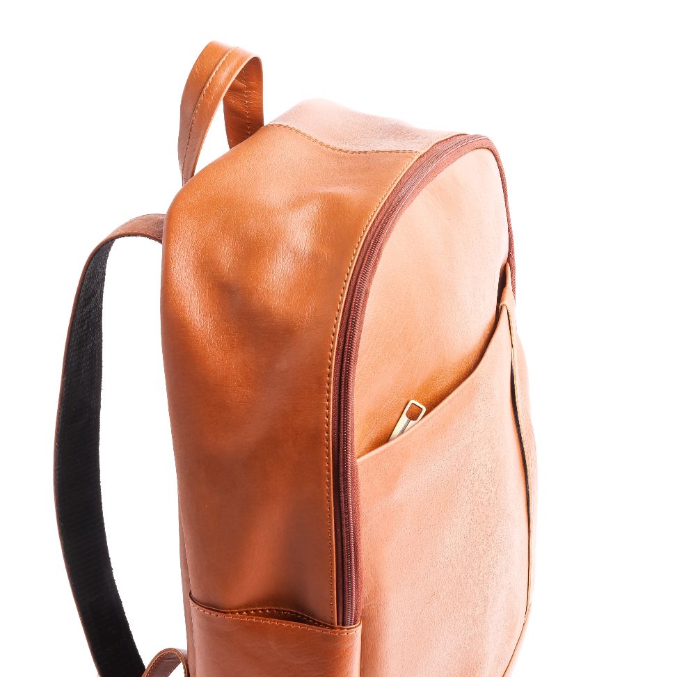 Tan brown On-The-Go Leather Backpack showcasing its sleek design and multiple compartments.