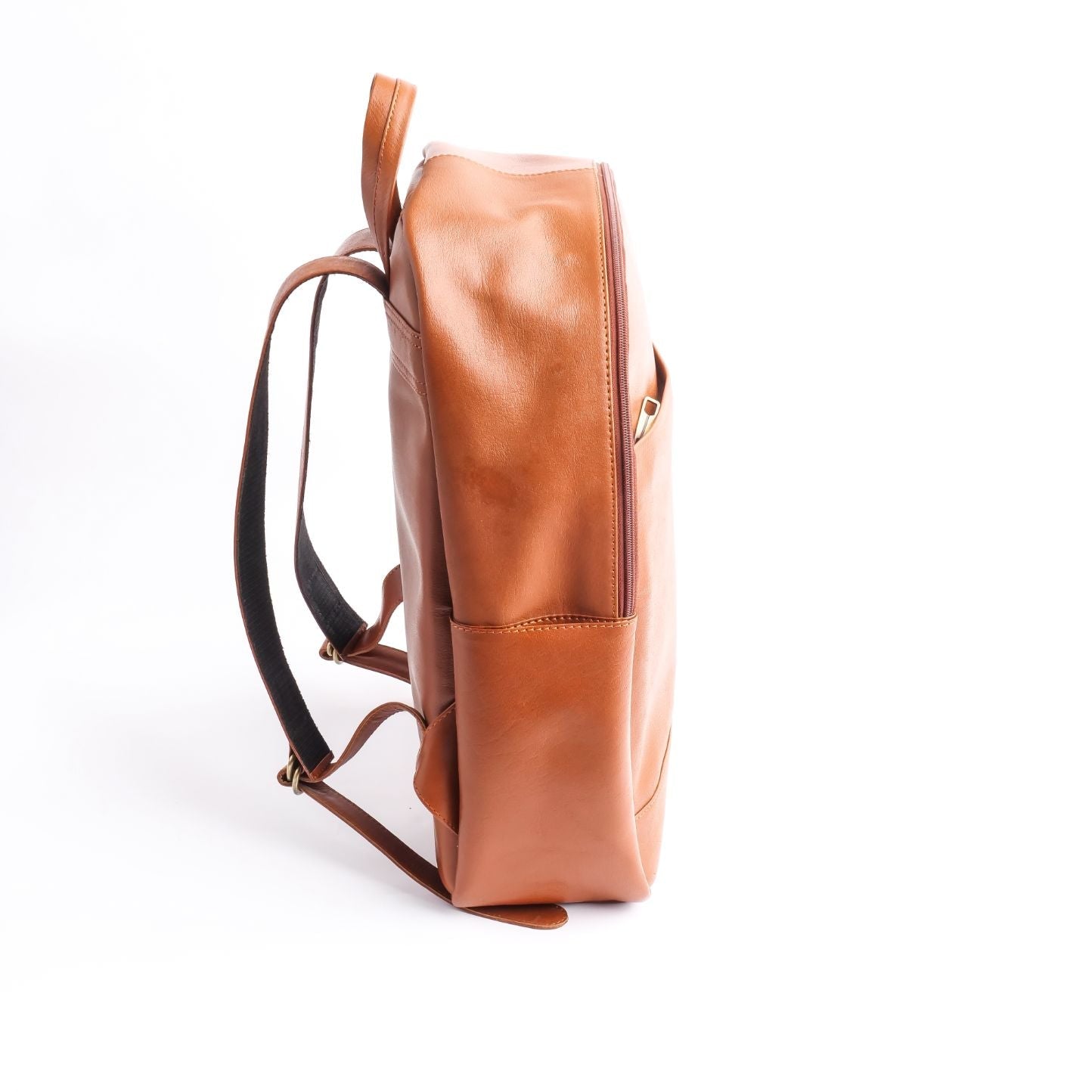 Tan brown On-The-Go Leather Backpack showcasing its sleek design and multiple compartments.