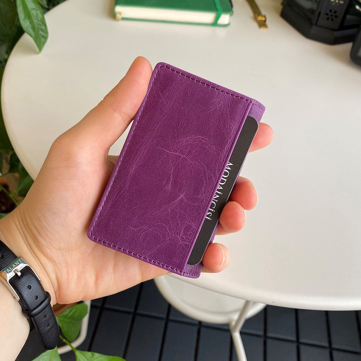 Orsa Genuine Leather Premium Credit Card Holder in various colors, showcasing its sleek design and card slots.