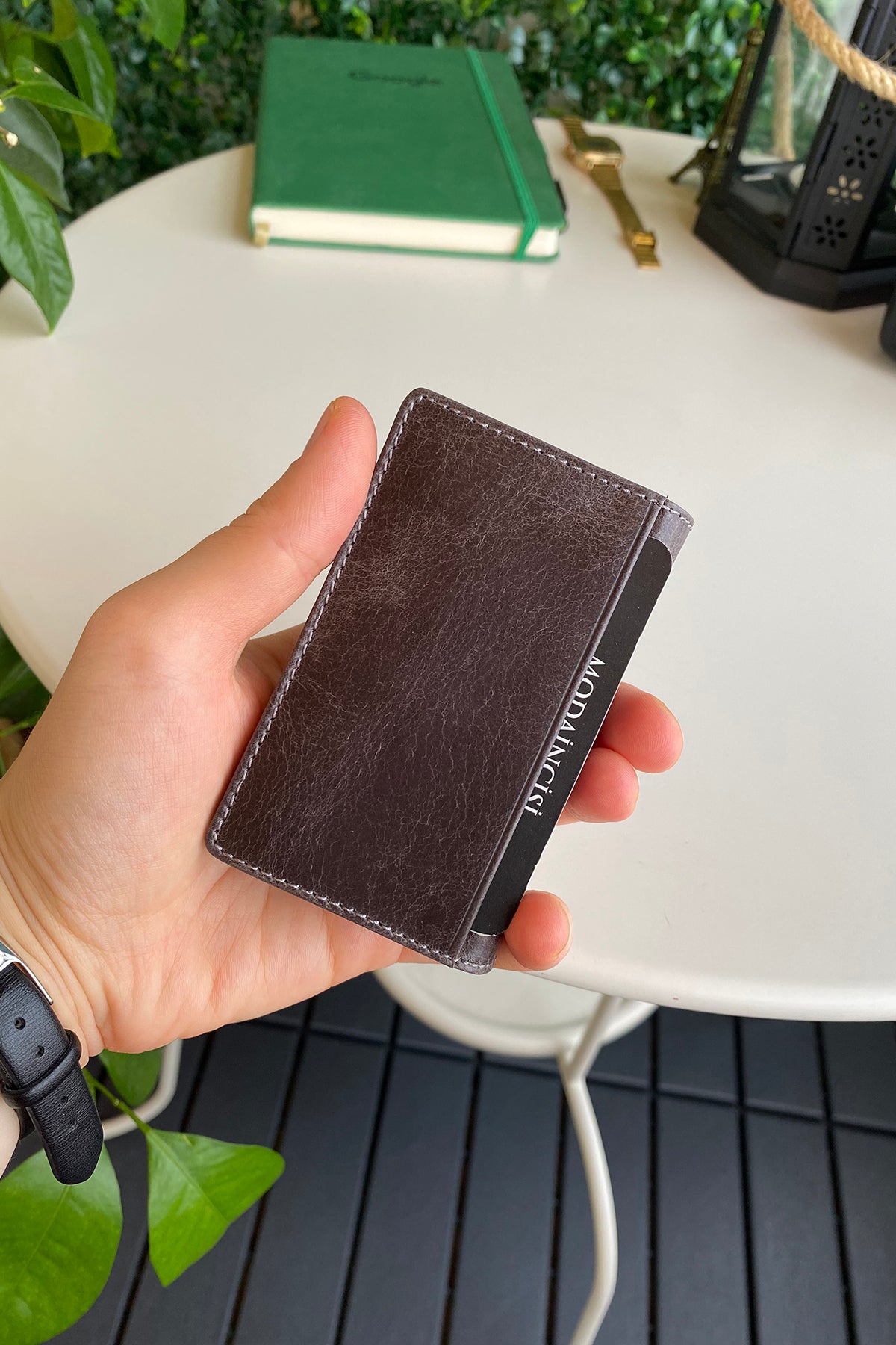 Orsa Genuine Leather Premium Credit Card Holder in various colors, showcasing its sleek design and card slots.