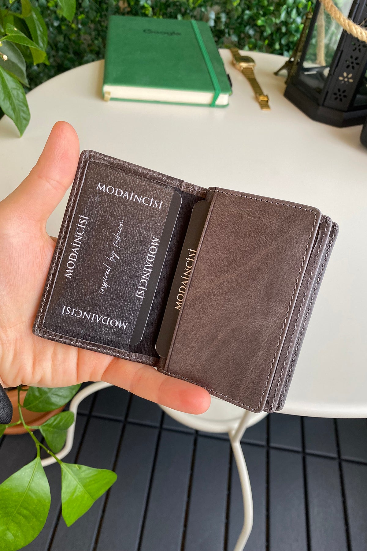 Orsa Genuine Leather Premium Credit Card Holder in various colors, showcasing its sleek design and card slots.