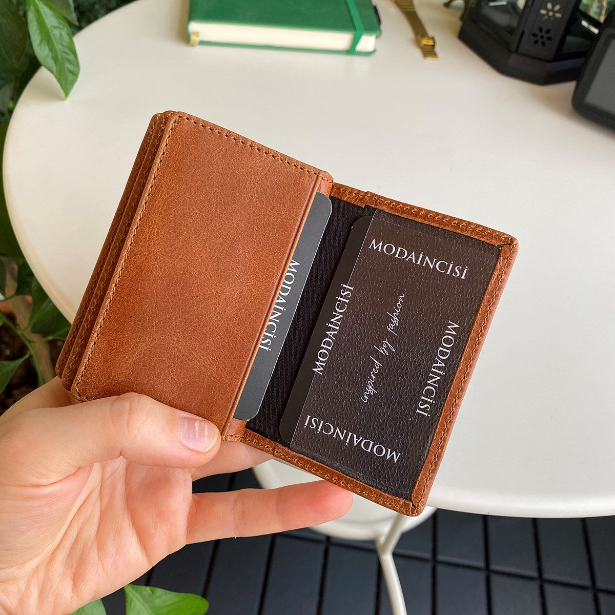 Orsa Genuine Leather Premium Credit Card Holder in various colors, showcasing its sleek design and card slots.