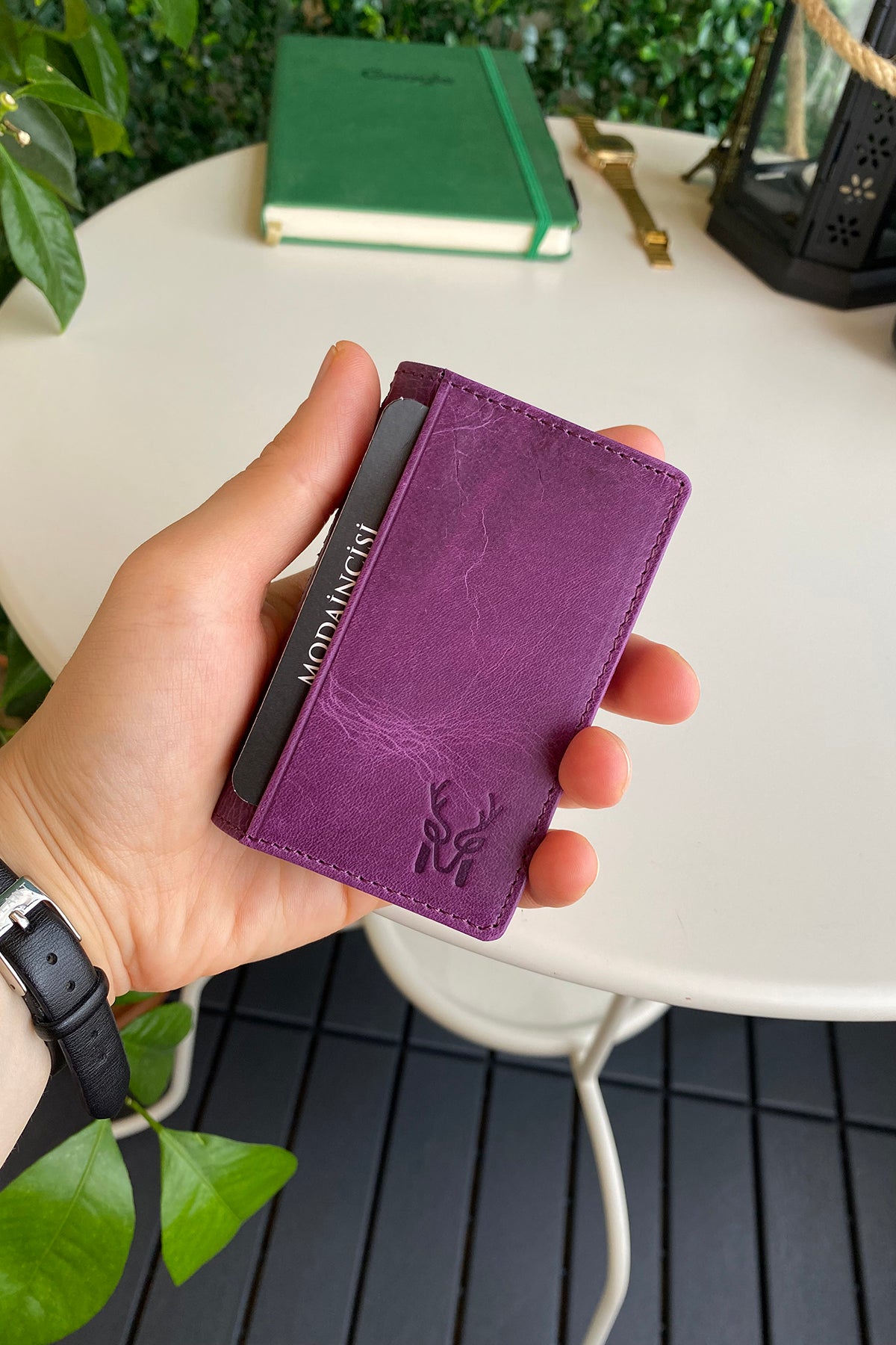 Orsa Genuine Leather Premium Credit Card Holder in various colors, showcasing its sleek design and card slots.