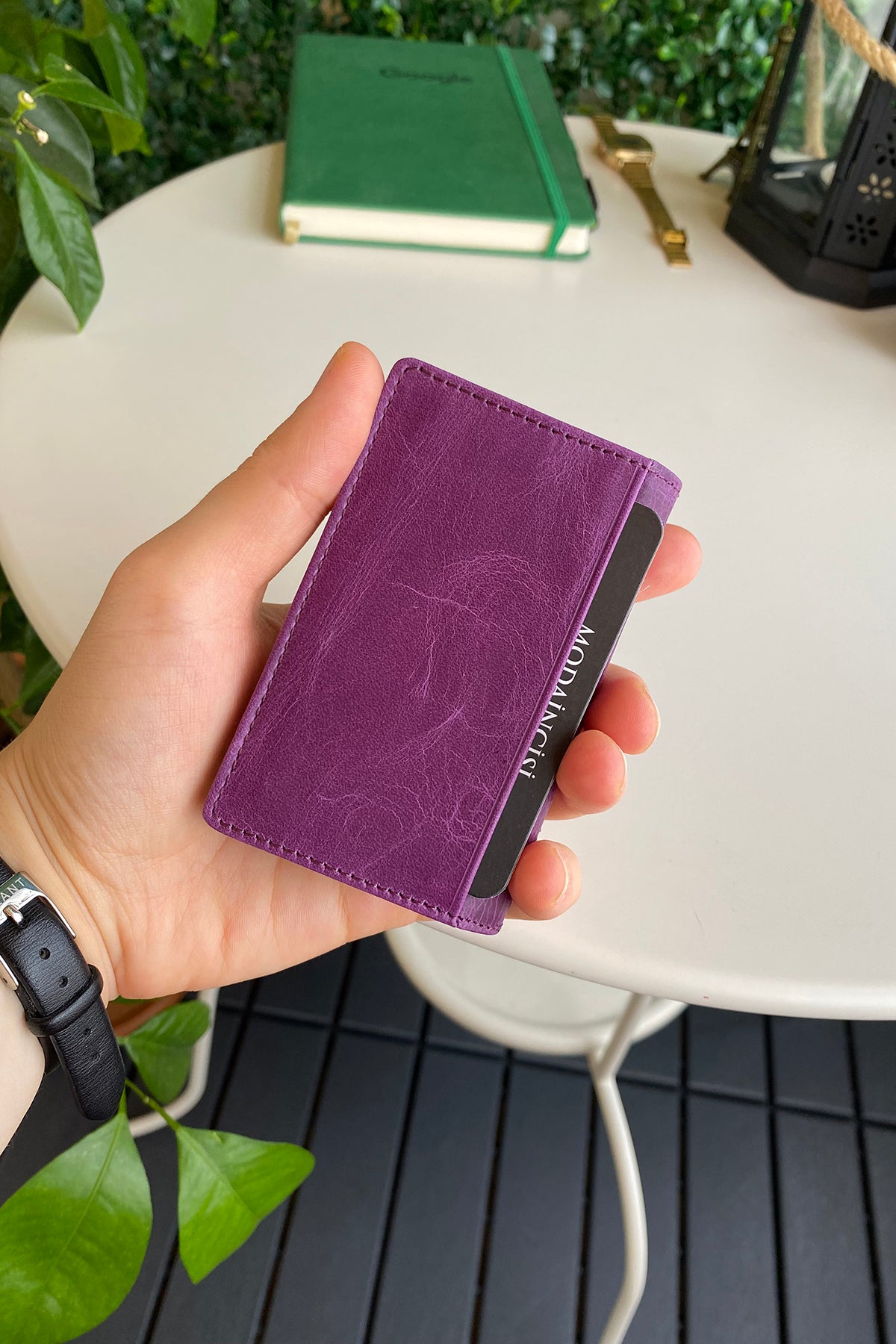 Orsa Genuine Leather Premium Credit Card Holder in various colors, showcasing its sleek design and card slots.