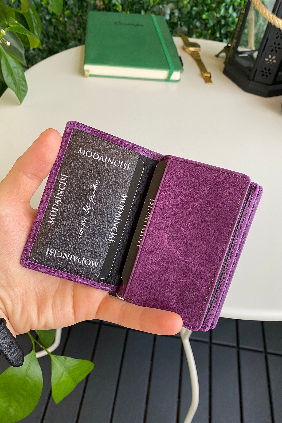 Orsa Genuine Leather Premium Credit Card Holder in various colors, showcasing its sleek design and card slots.