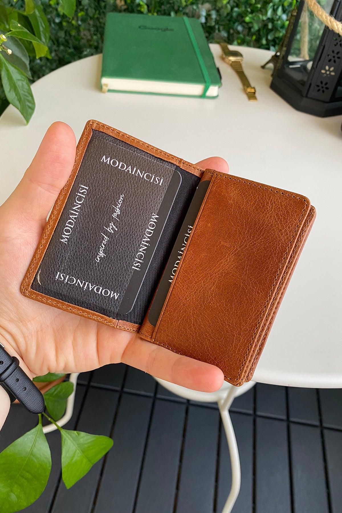 Orsa Genuine Leather Premium Credit Card Holder in various colors, showcasing its sleek design and card slots.