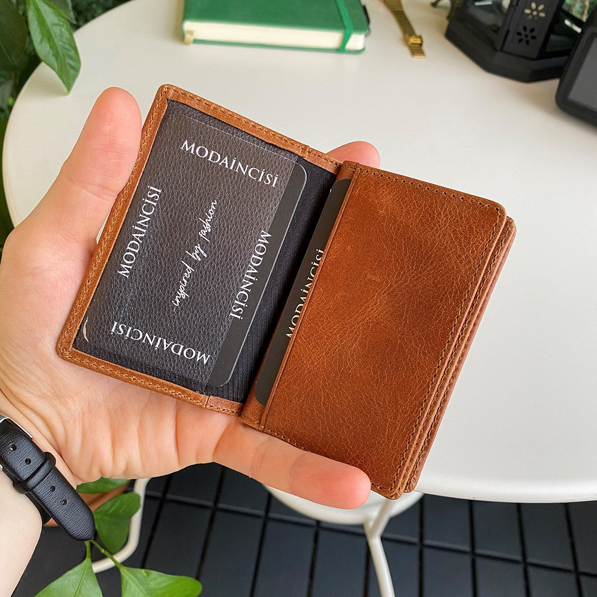 Orsa Genuine Leather Premium Credit Card Holder in various colors, showcasing its sleek design and card slots.