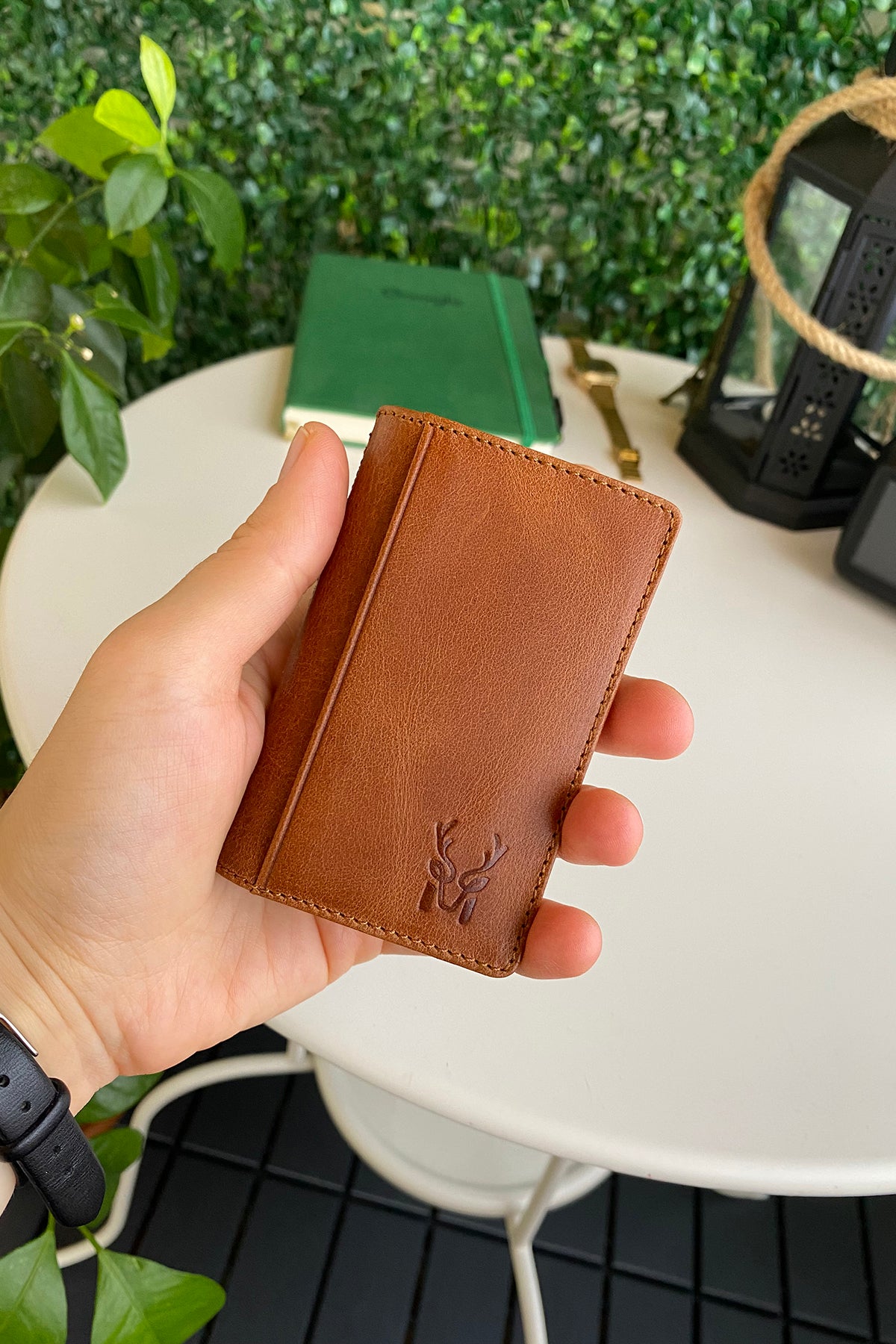 Orsa Genuine Leather Premium Credit Card Holder in various colors, showcasing its sleek design and card slots.