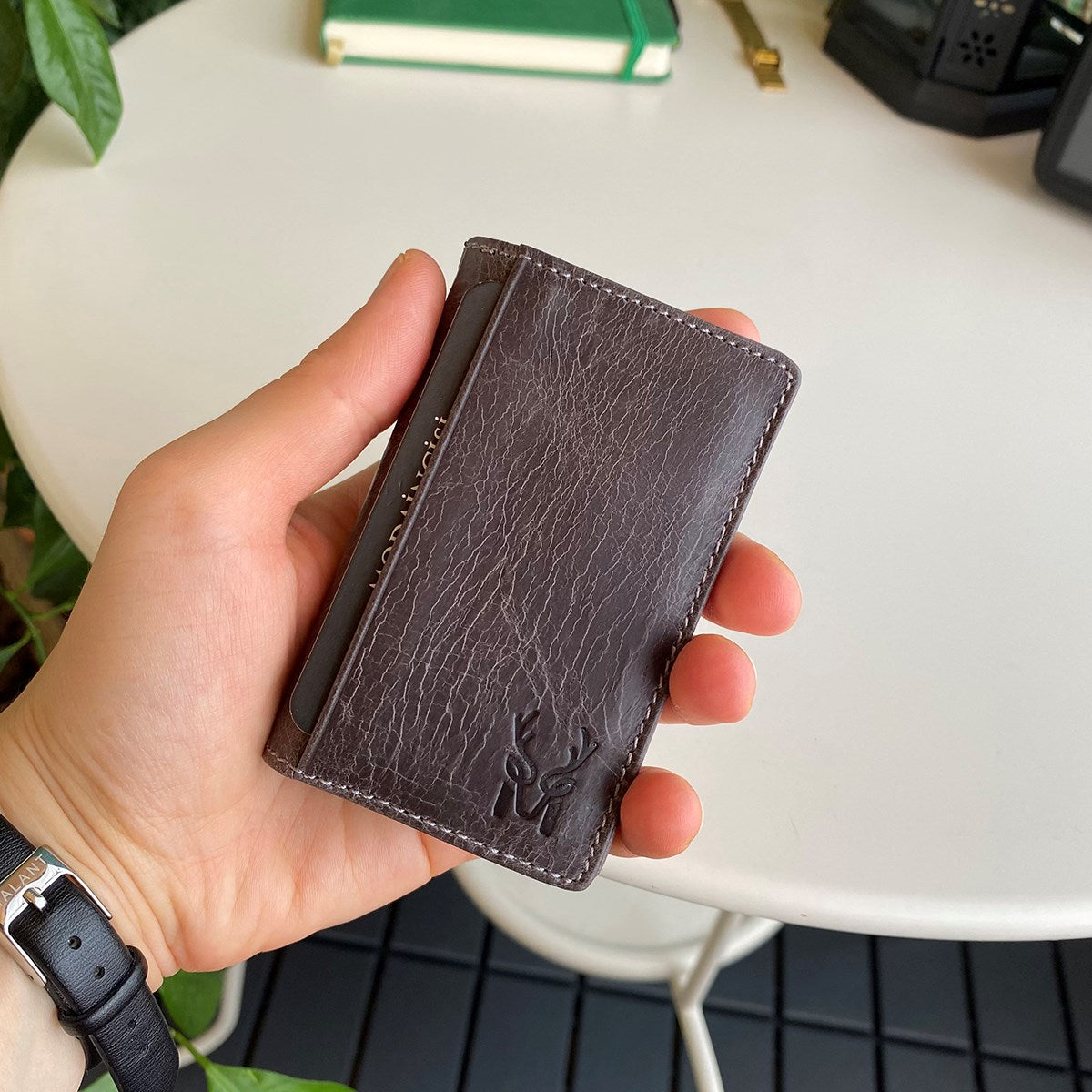 Orsa Genuine Leather Premium Credit Card Holder in various colors, showcasing its sleek design and card slots.