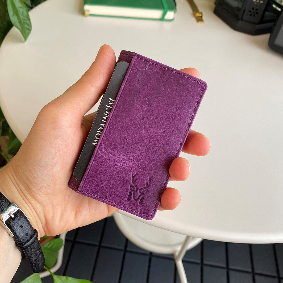 Orsa Genuine Leather Premium Credit Card Holder in various colors, showcasing its sleek design and card slots.