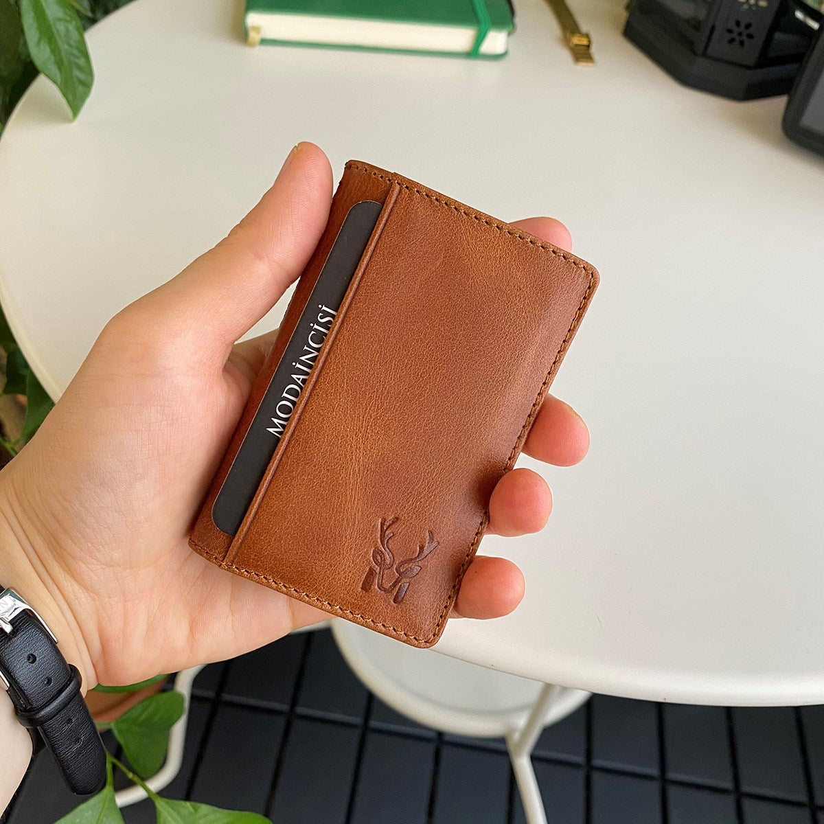 Orsa Genuine Leather Premium Credit Card Holder in various colors, showcasing its sleek design and card slots.