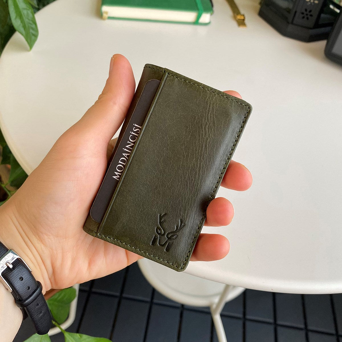 Orsa Genuine Leather Premium Credit Card Holder in various colors, showcasing its sleek design and card slots.