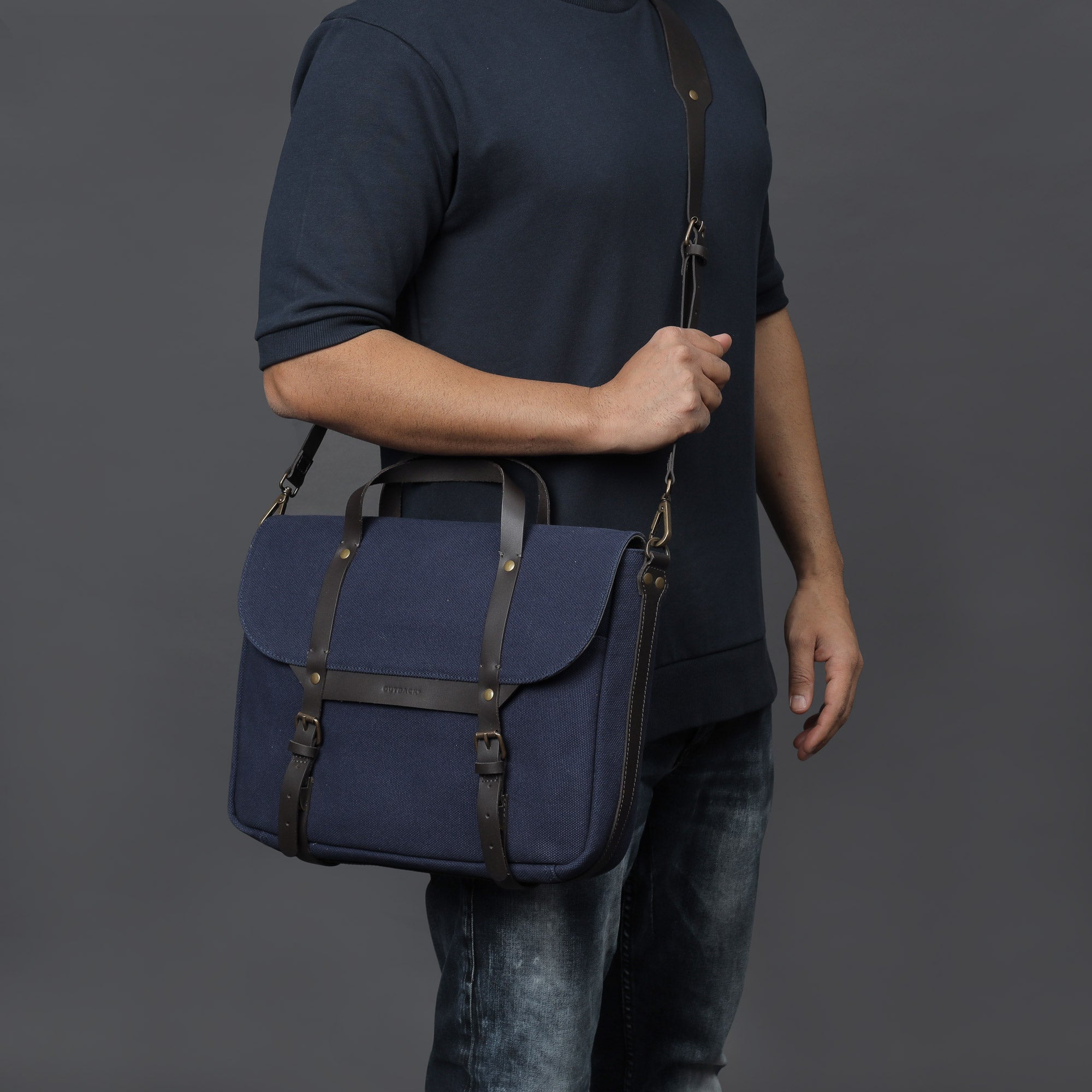 Oslo Canvas Briefcase showcasing its durable cotton canvas, leather straps, and multiple pockets for organization.