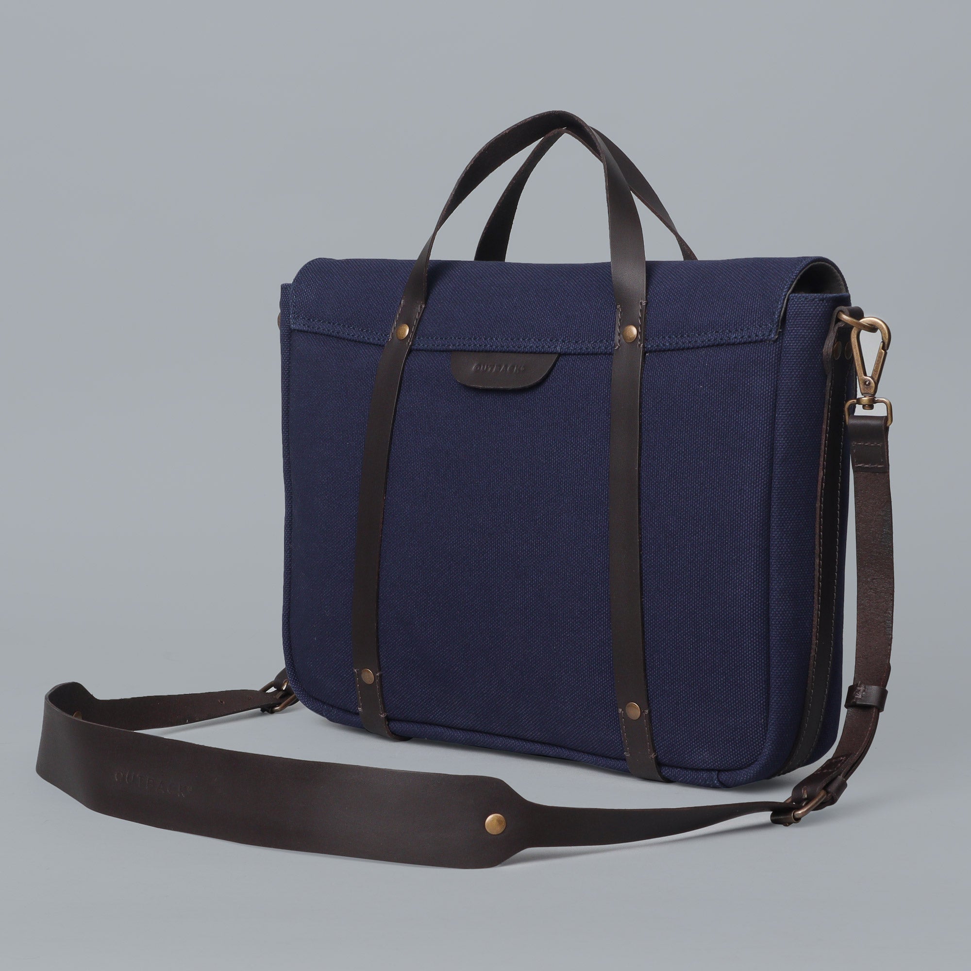 Oslo Canvas Briefcase showcasing its durable cotton canvas, leather straps, and multiple pockets for organization.