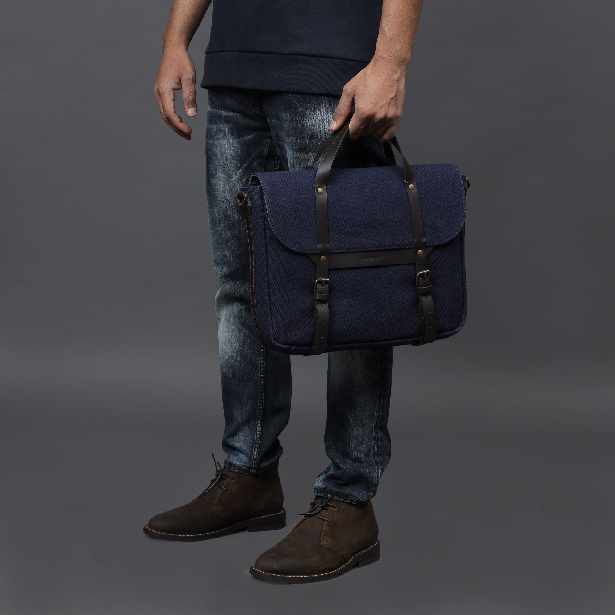 Oslo Canvas Briefcase showcasing its durable cotton canvas, leather straps, and multiple pockets for organization.