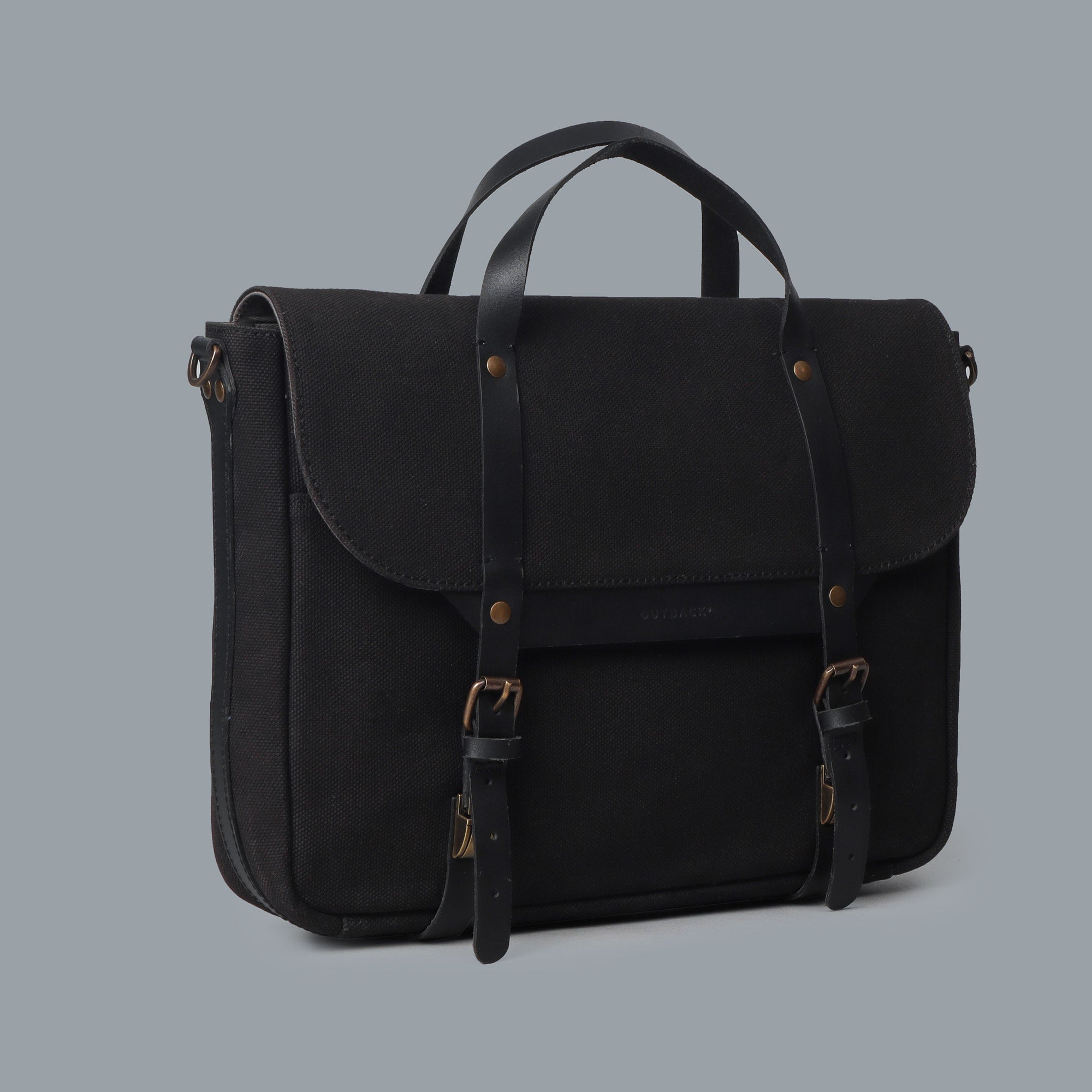 Oslo Canvas Briefcase showcasing its durable cotton canvas material and leather straps, designed for laptops up to 13 inches.