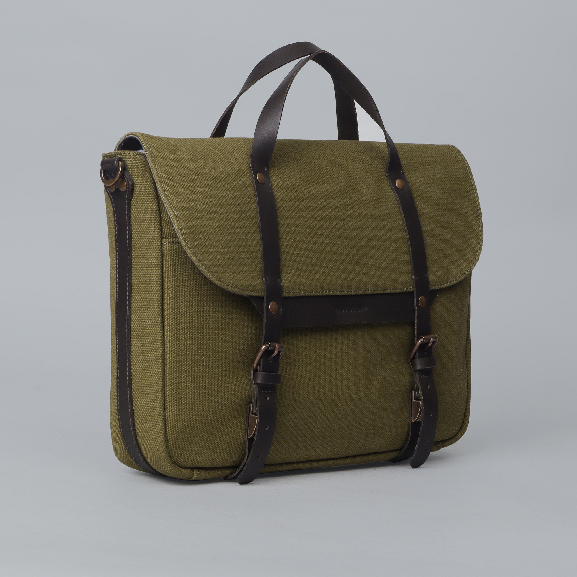 Oslo Canvas Briefcase made from durable cotton canvas, featuring leather straps and multiple pockets for organization, suitable for laptops up to 13 inches.