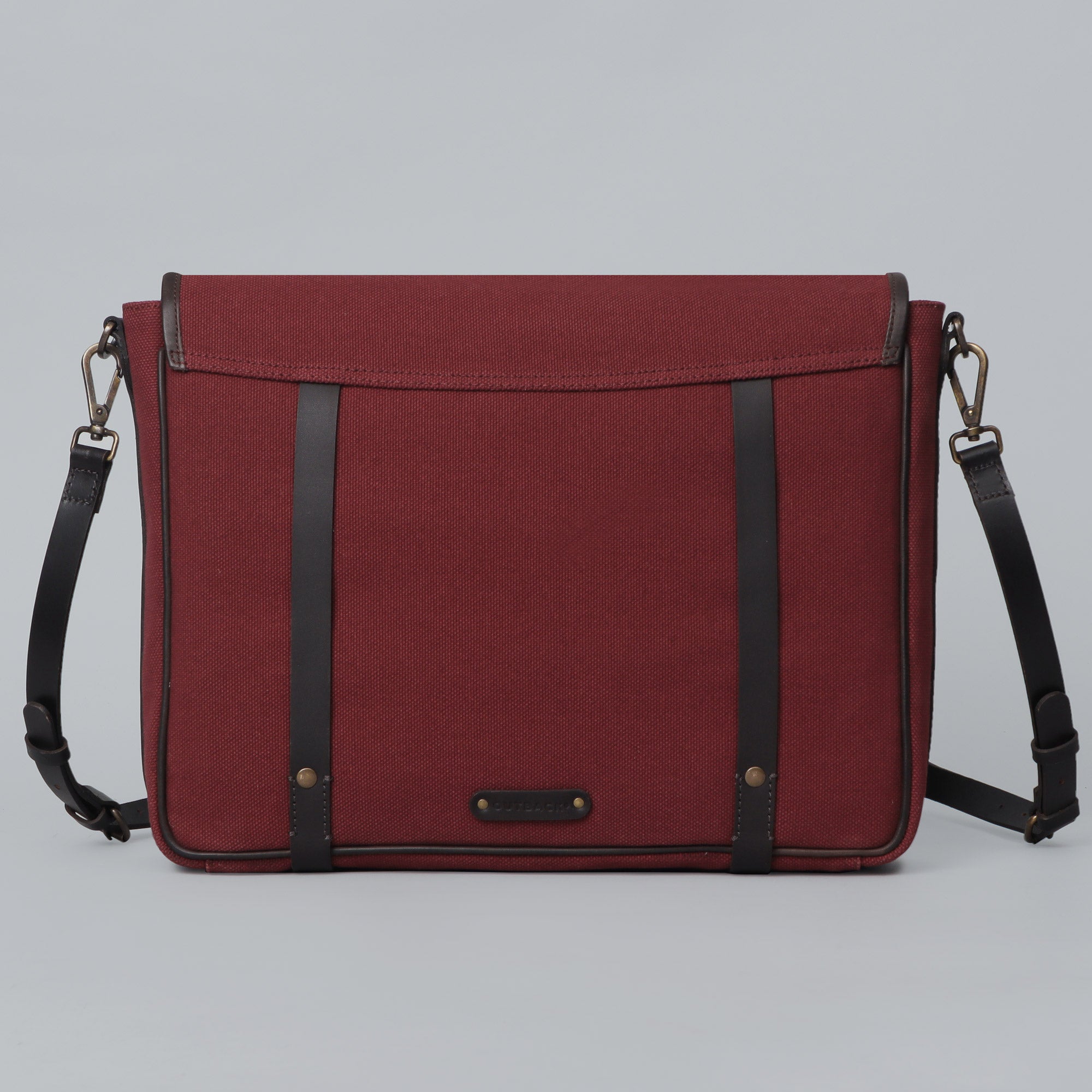 Oslo Canvas Messenger Bag featuring a durable design with leather strap and multiple compartments for laptop and essentials.