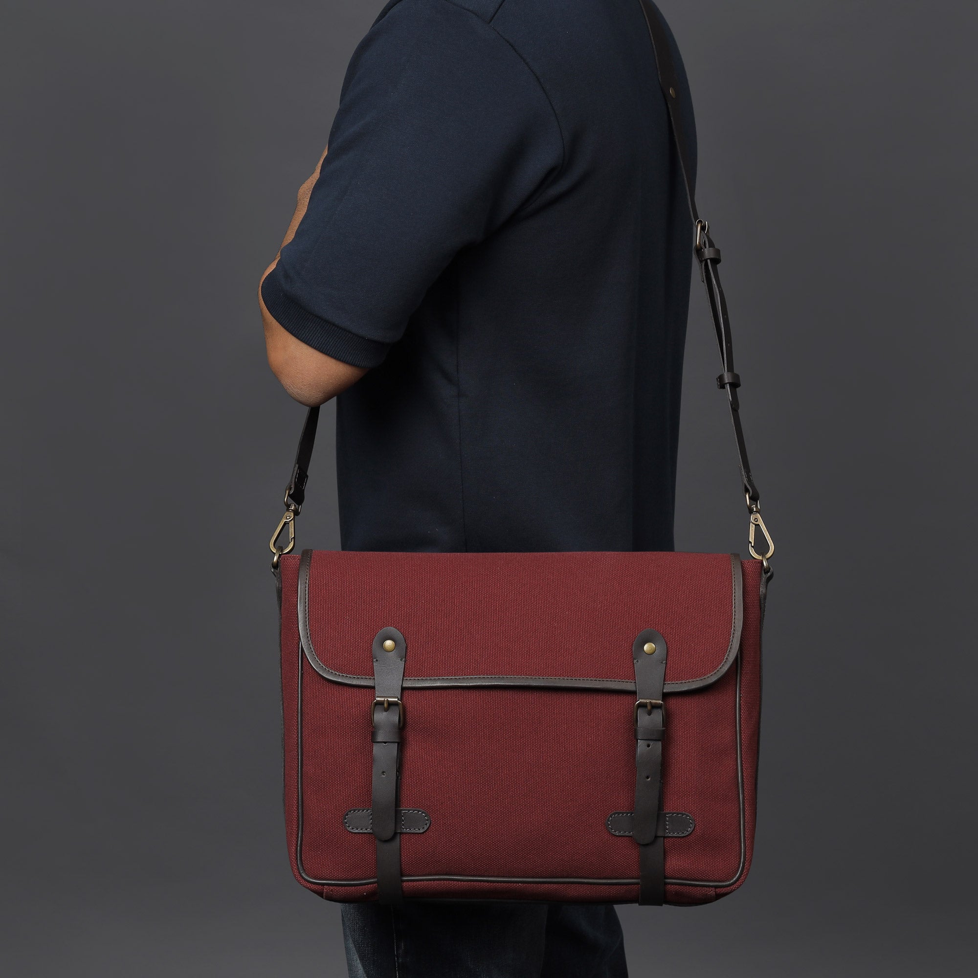 Oslo Canvas Messenger Bag featuring a durable design with leather strap and multiple compartments for laptop and essentials.