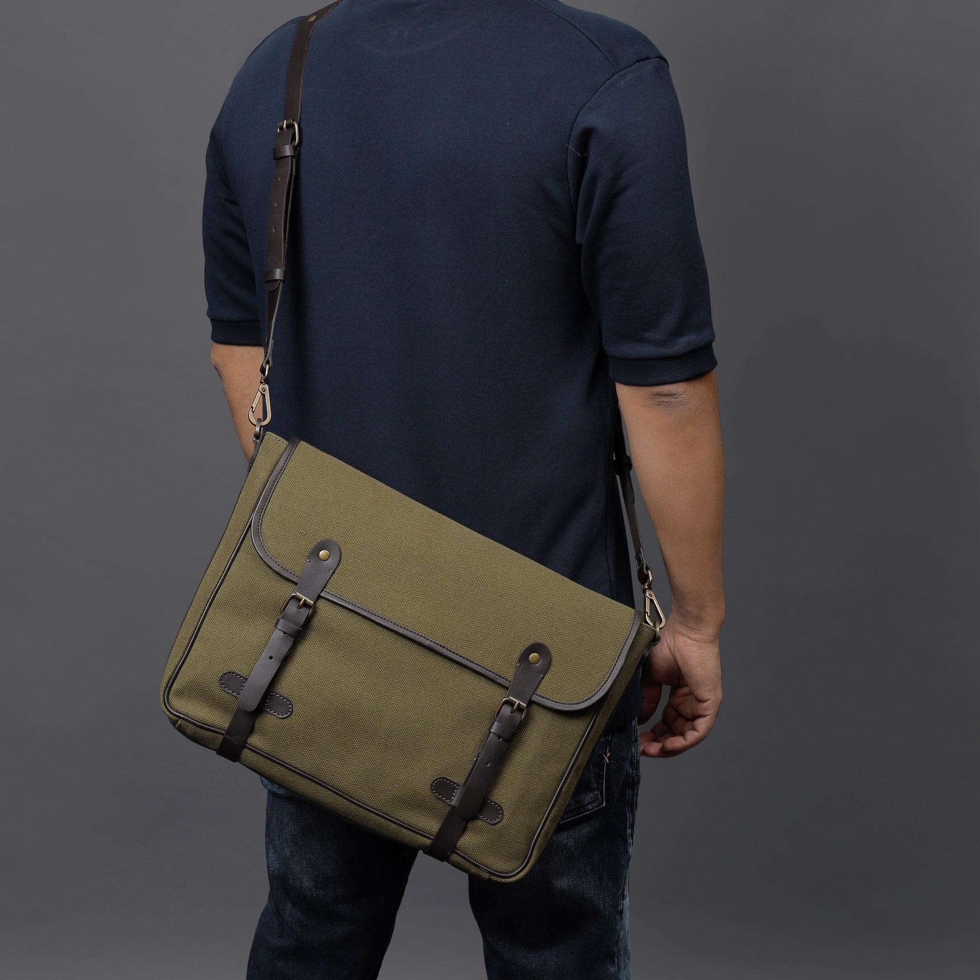 Oslo Canvas Messenger Bag featuring a durable design, leather strap, and multiple compartments for organization.