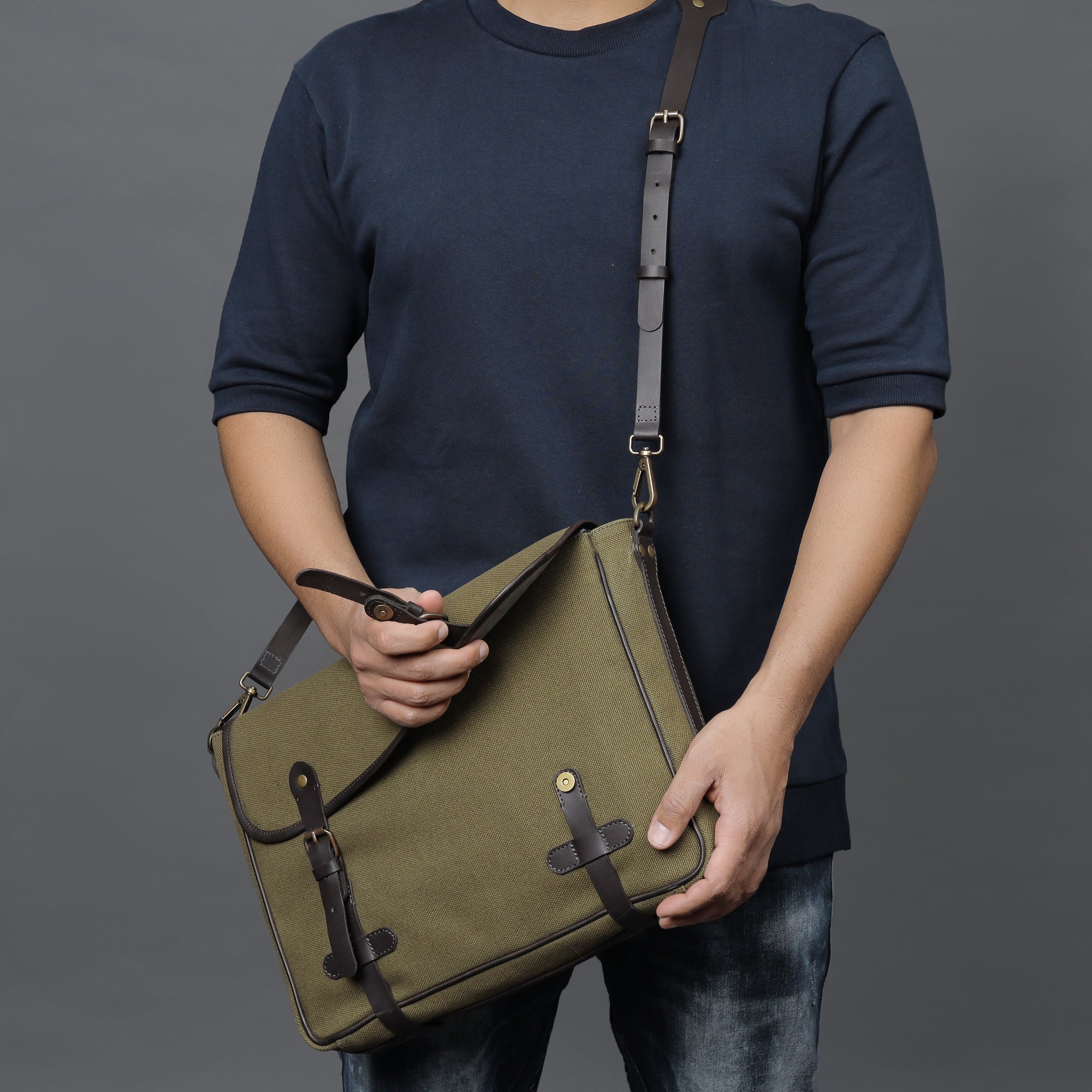 Oslo Canvas Messenger Bag featuring a durable design, leather strap, and multiple compartments for organization.