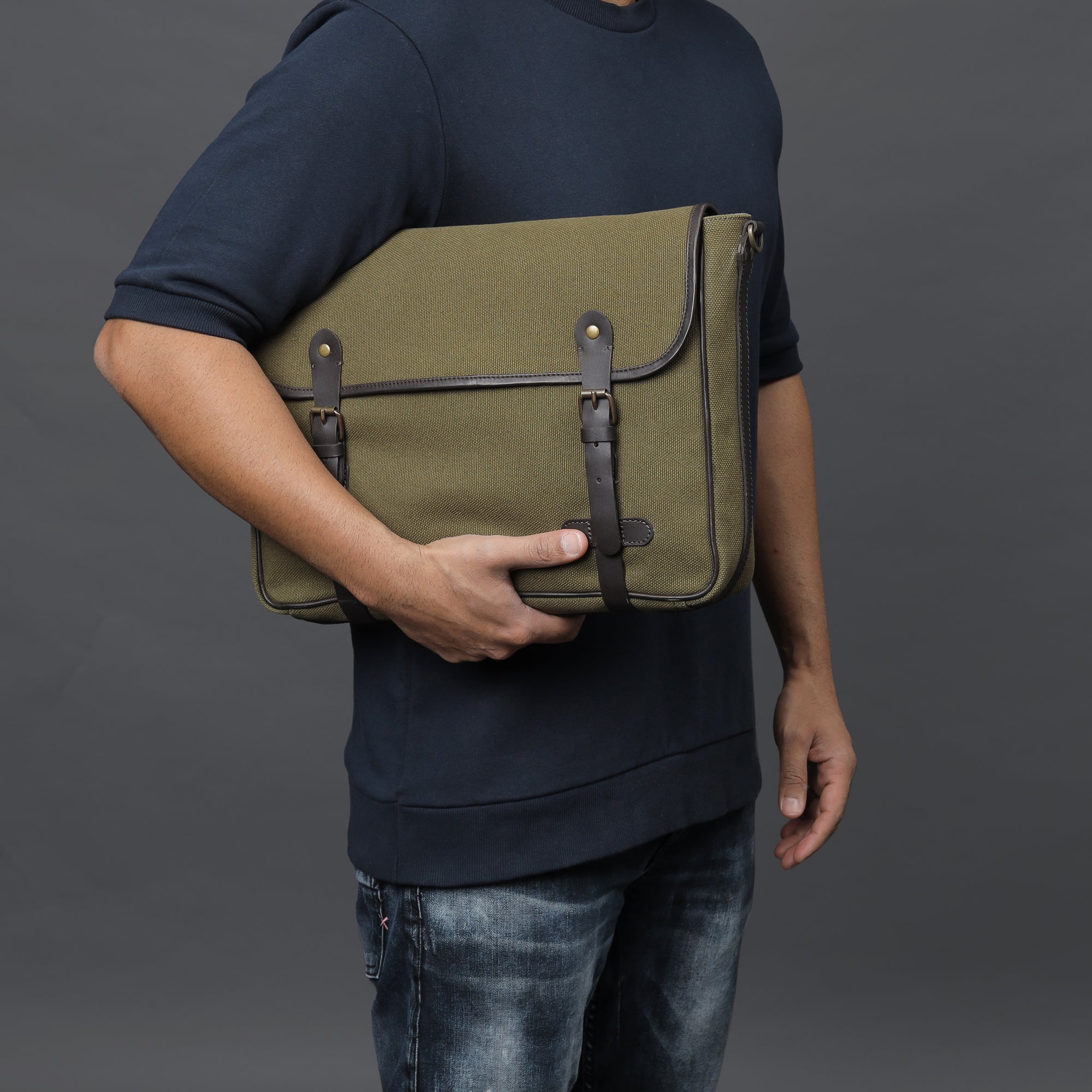 Oslo Canvas Messenger Bag featuring a durable design, leather strap, and multiple compartments for organization.