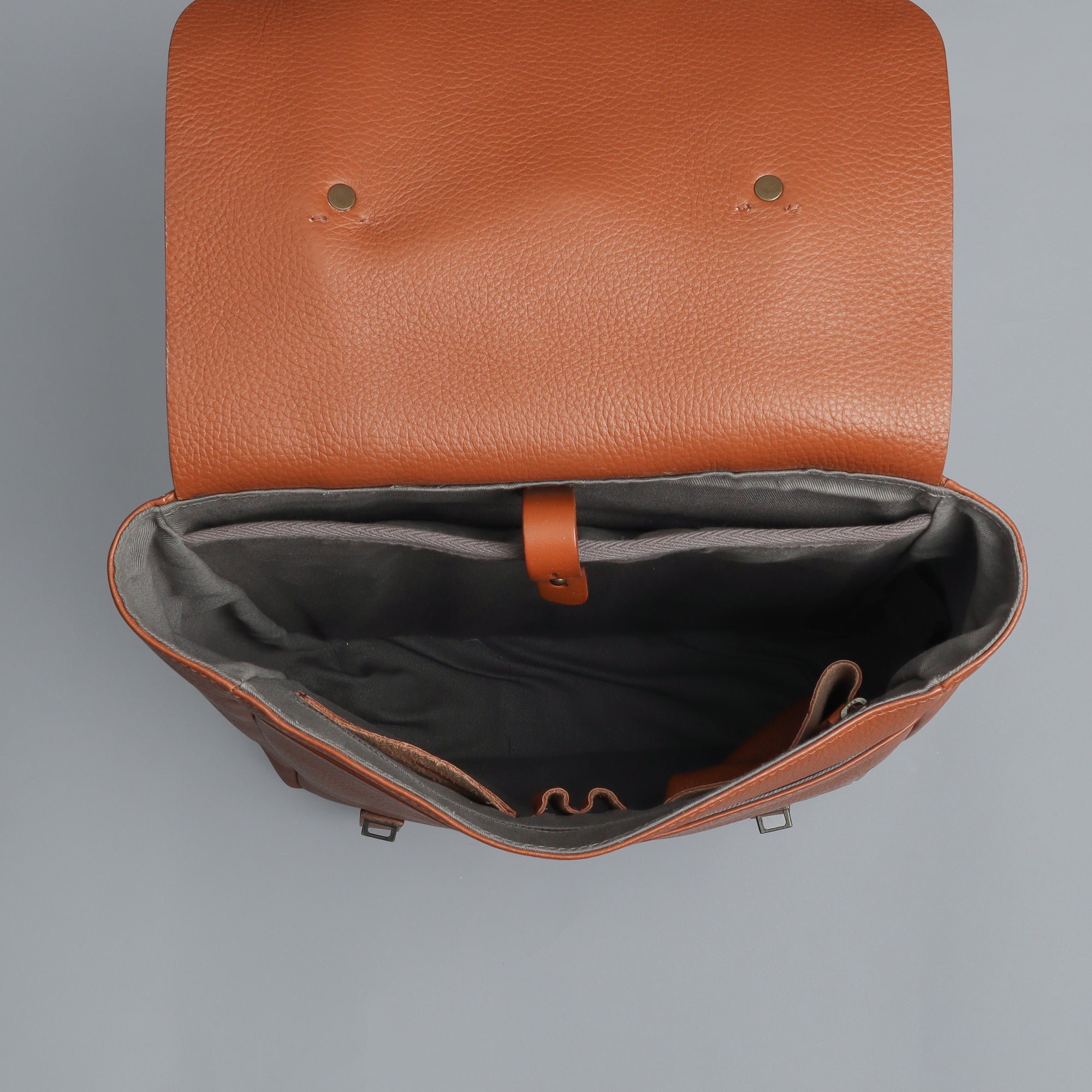 Oslo Leather Backpack made from premium full grain leather, featuring multiple pockets, adjustable straps, and a sleek design.